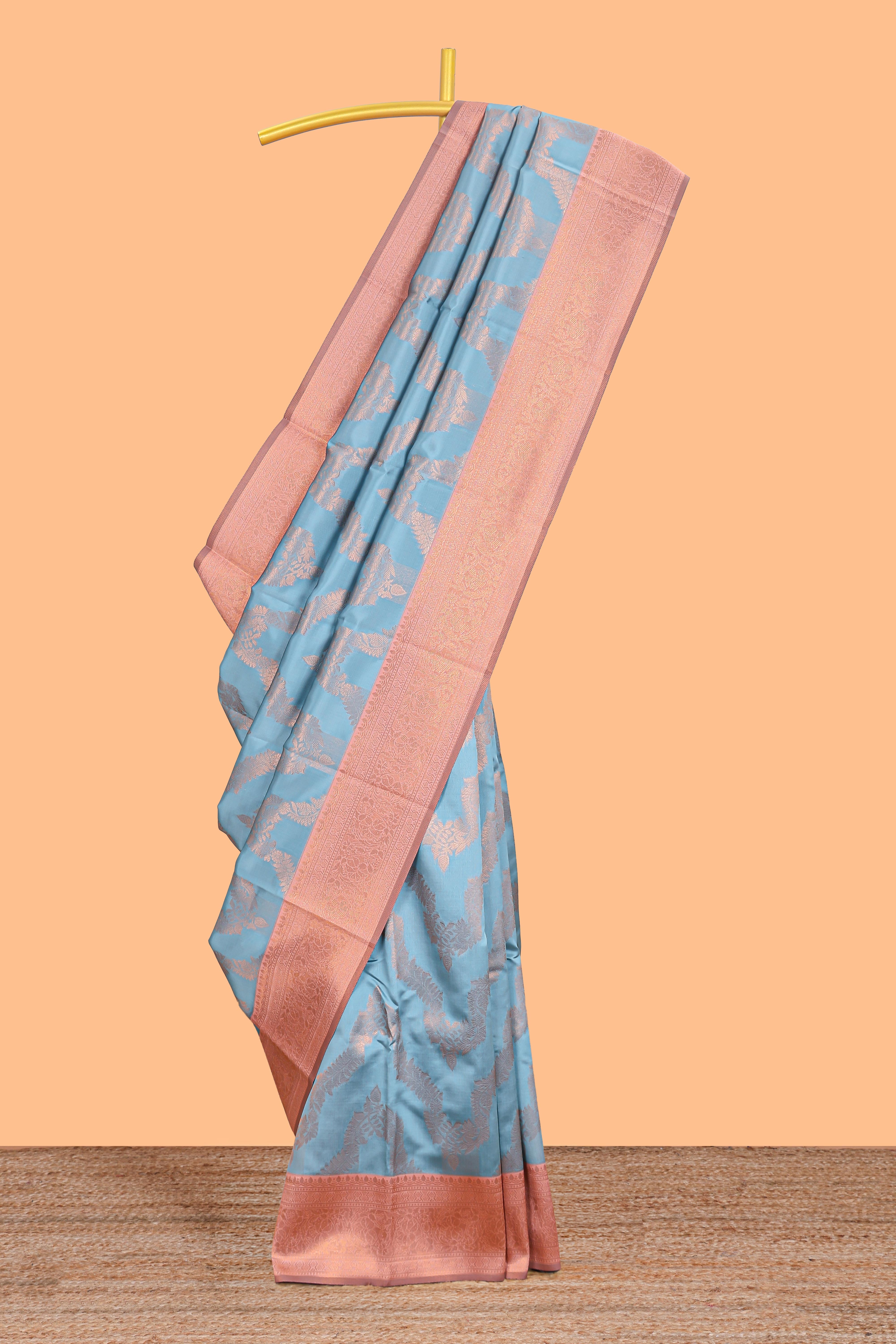 Sky blue chevron zari design litchi silk saree with contrast zari design border and contrast blouse