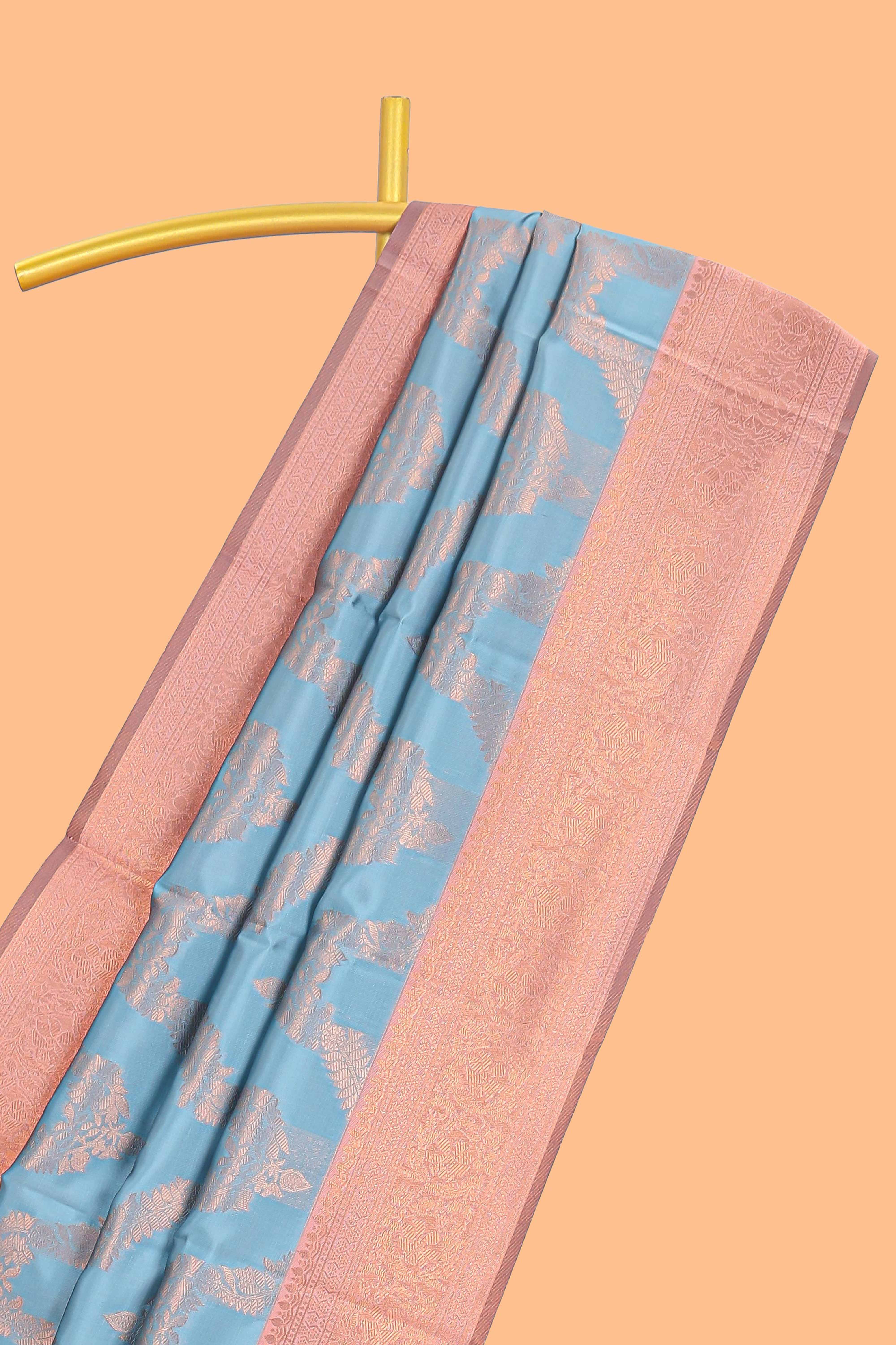 Sky blue chevron zari design litchi silk saree with contrast zari design border and contrast blouse