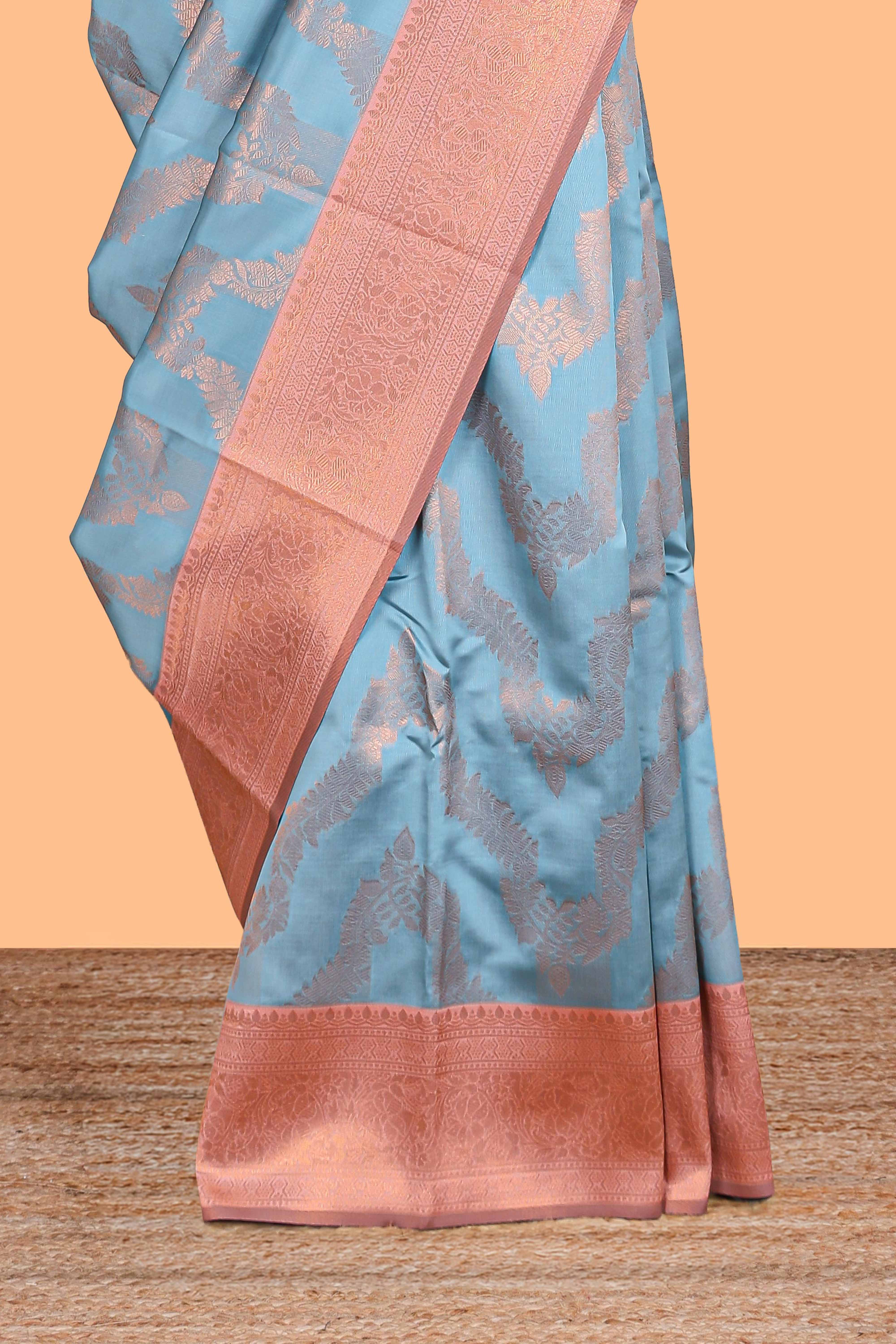 Sky blue chevron zari design litchi silk saree with contrast zari design border and contrast blouse