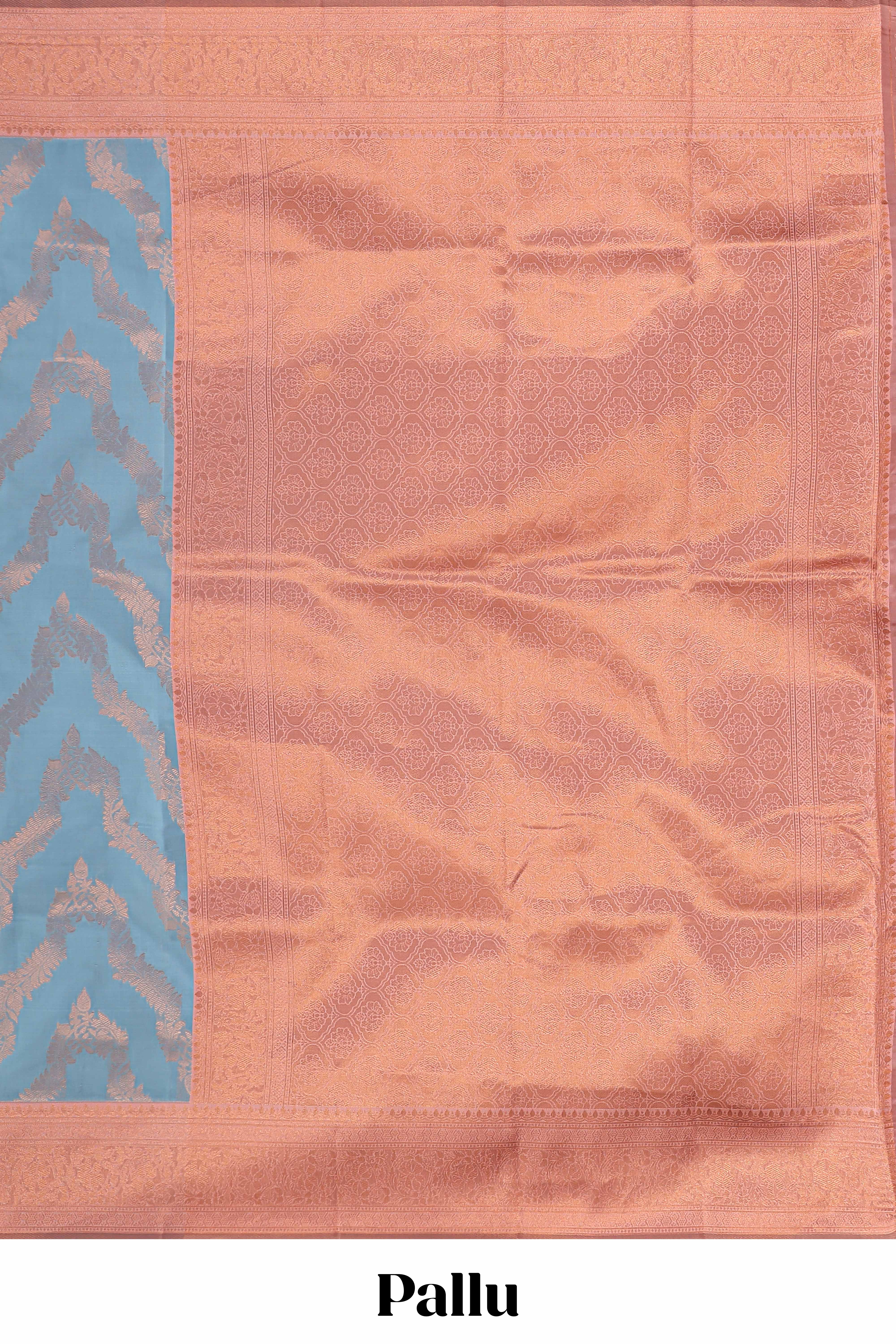 Sky blue chevron zari design litchi silk saree with contrast zari design border and contrast blouse
