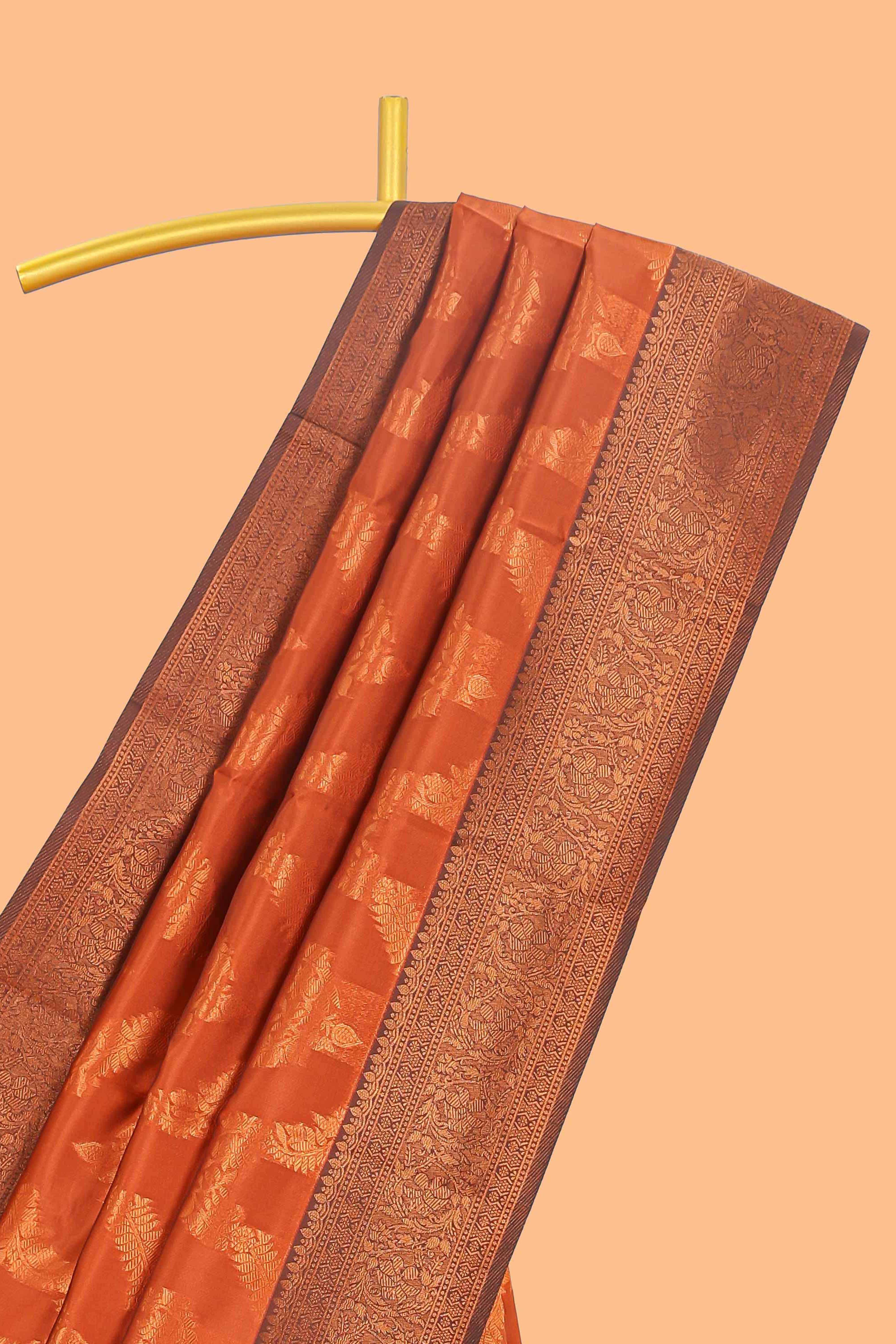 Orange chevron zari design litchi silk saree with contrast zari design border and contrast blouse