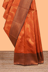 Orange chevron zari design litchi silk saree with contrast zari design border and contrast blouse