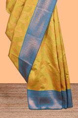 Mustard chevron zari design litchi silk saree with contrast zari design border and contrast blouse