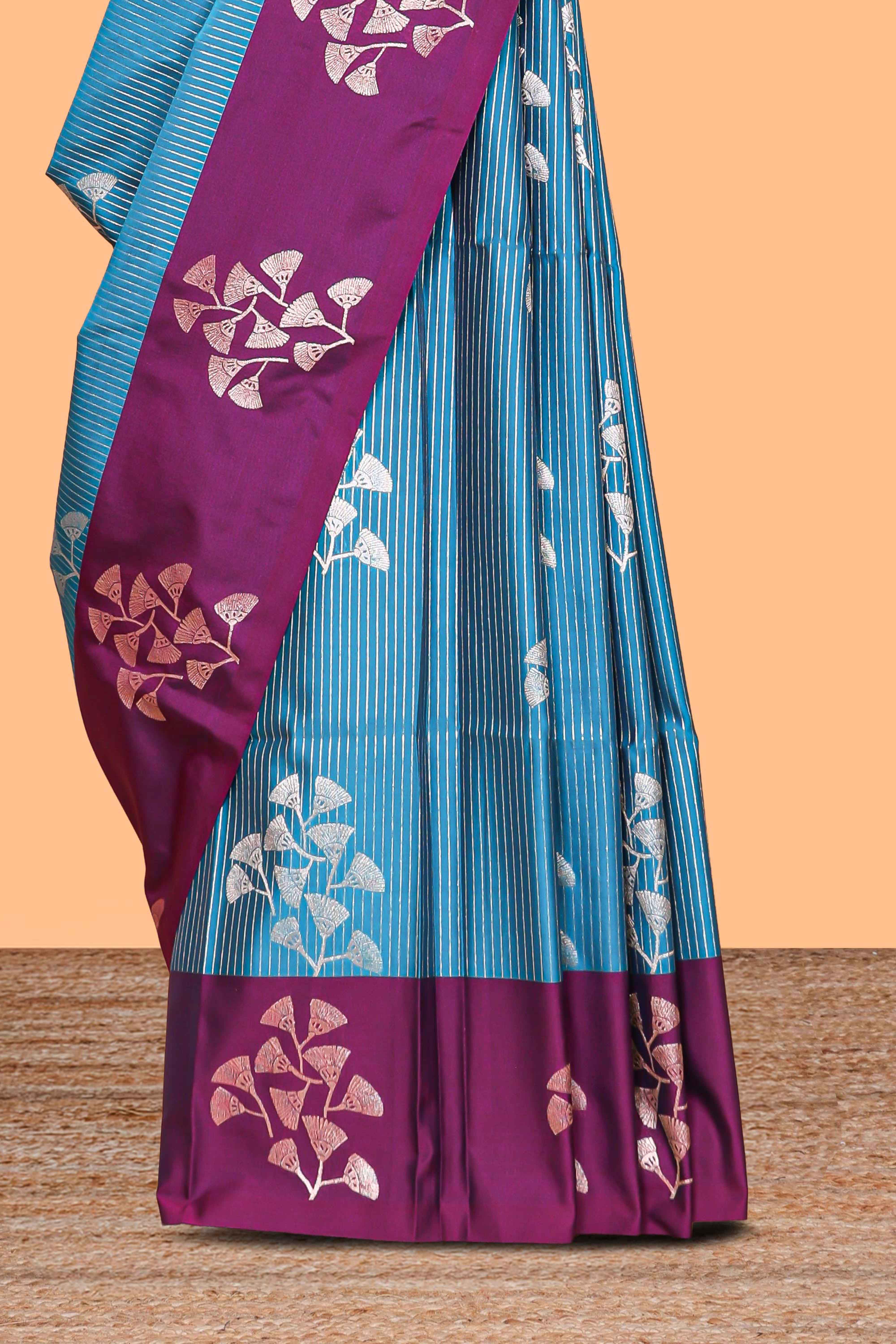 Blue striped floral zari design litchi silk saree with contrast zari design border and plain blouse