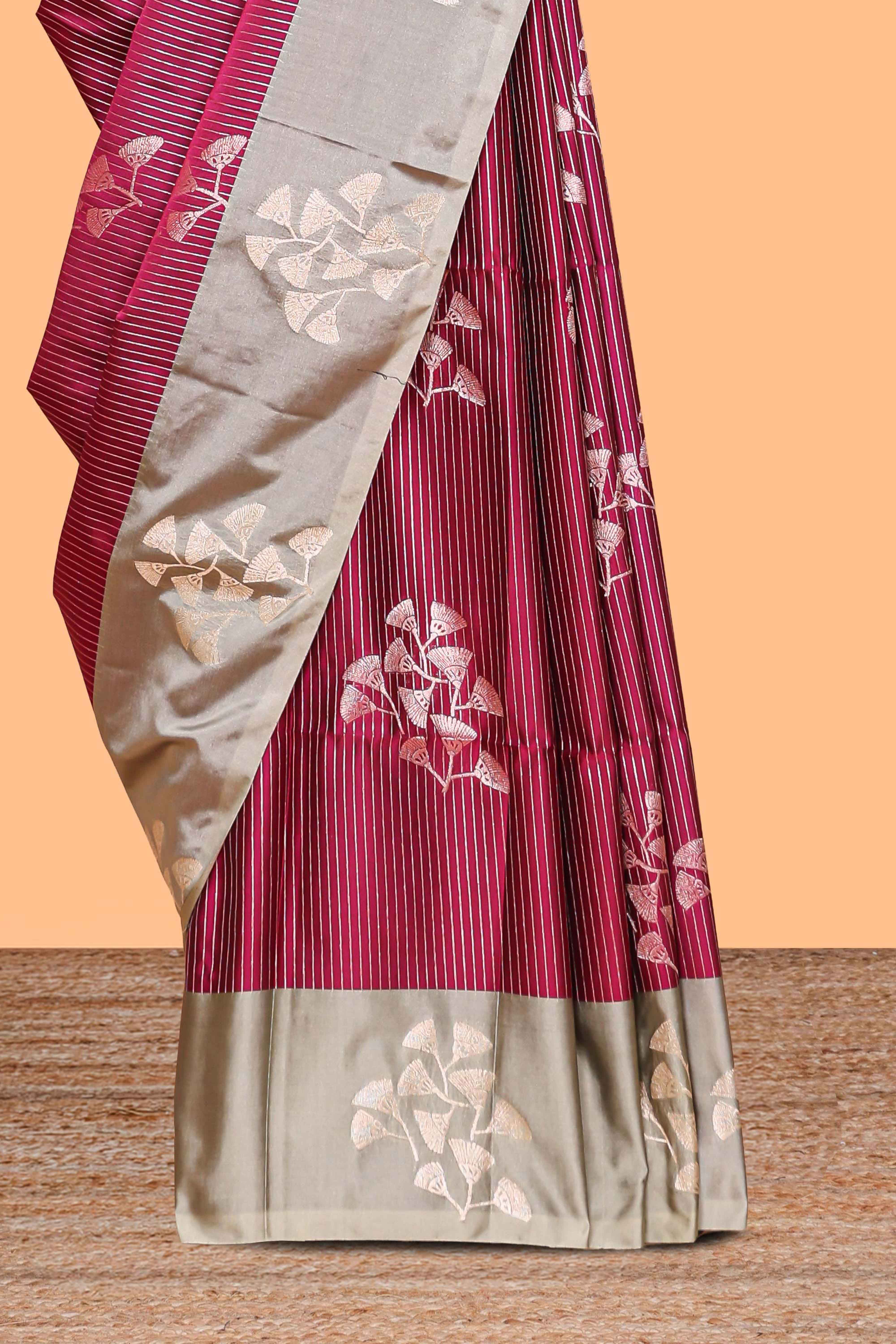 Maroon striped floral zari design litchi silk saree with contrast zari design border and plain blouse