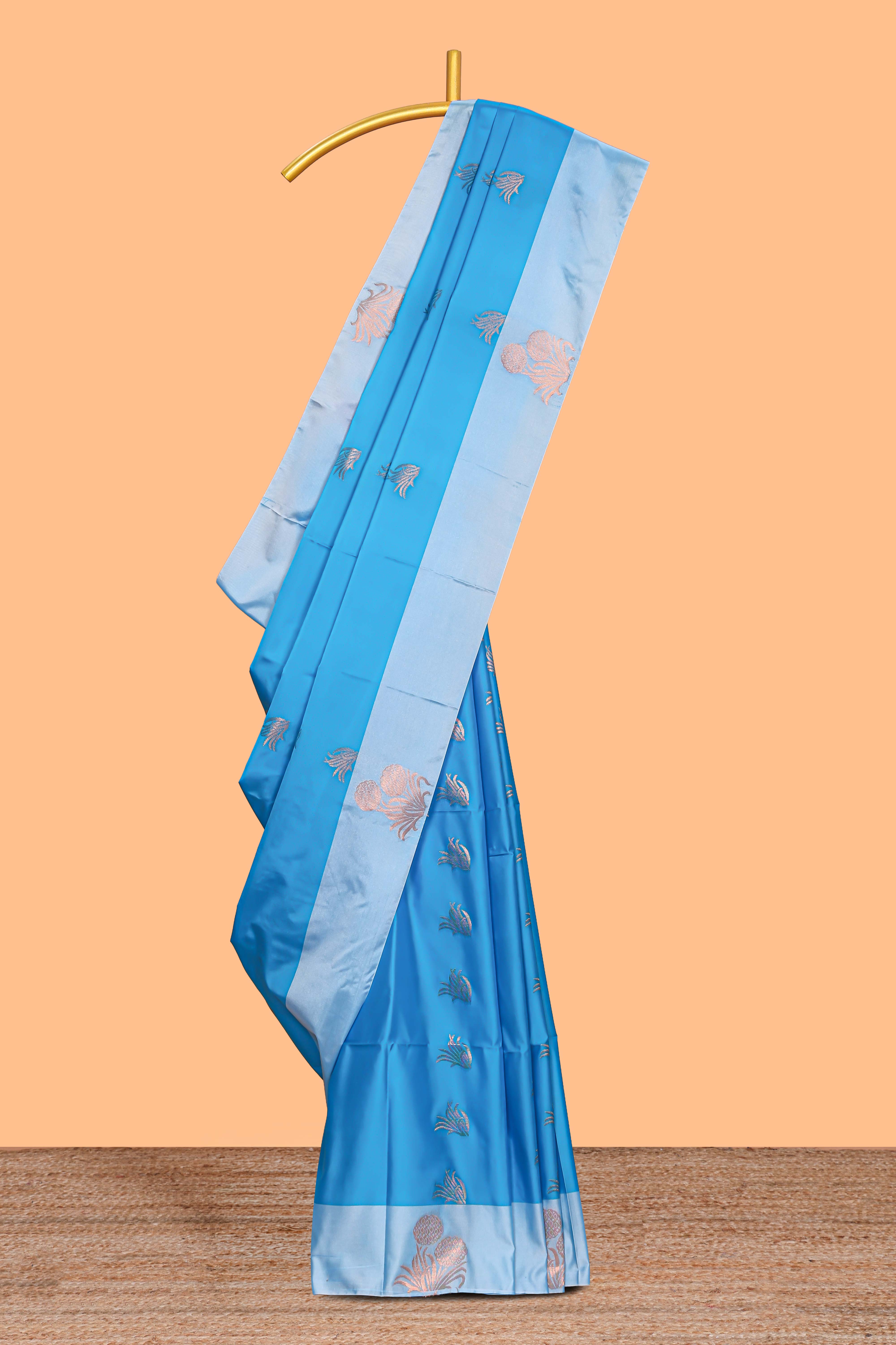 Blue zari motifs design litchi silk saree with contrast zari design border and plain blouse
