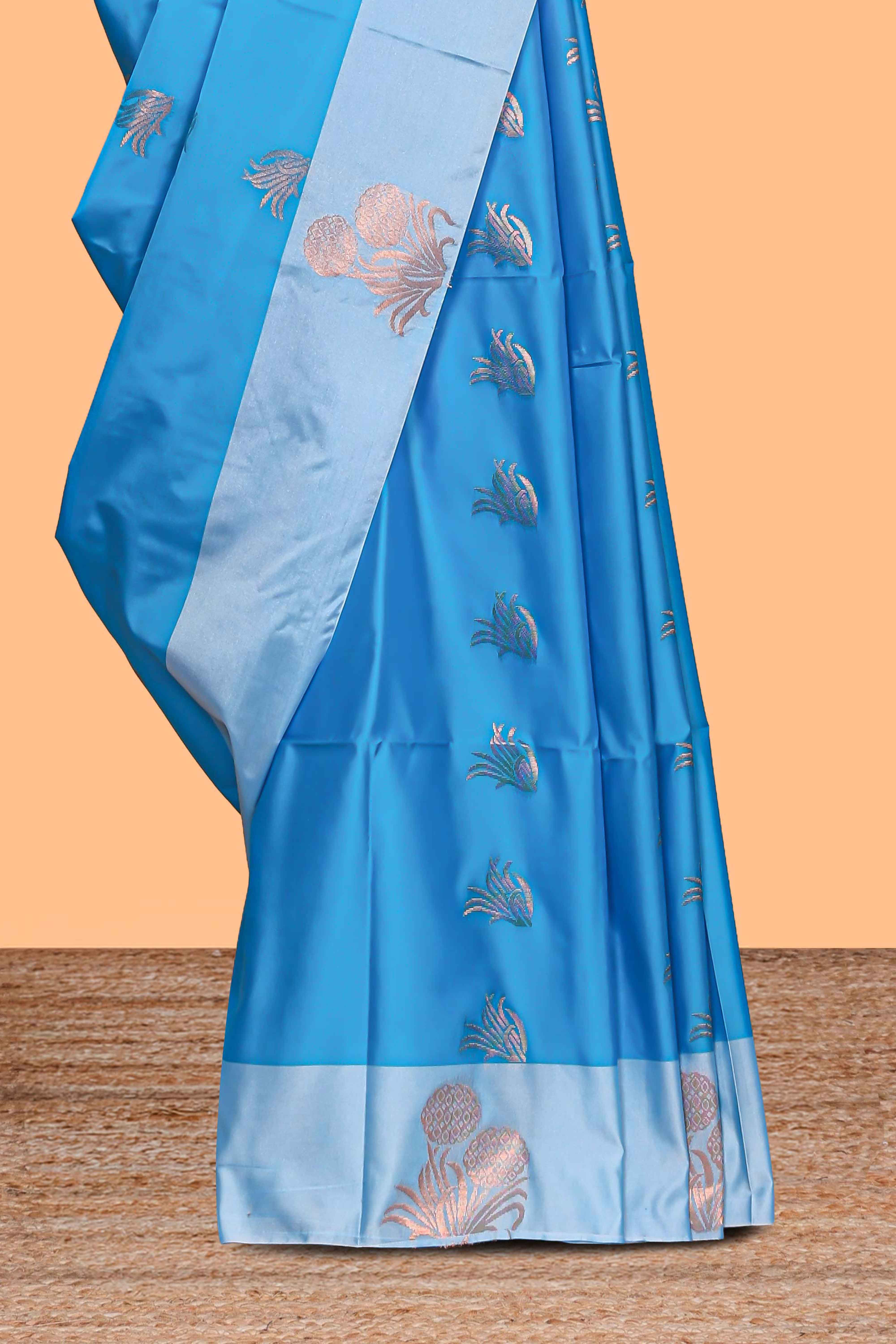 Blue zari motifs design litchi silk saree with contrast zari design border and plain blouse