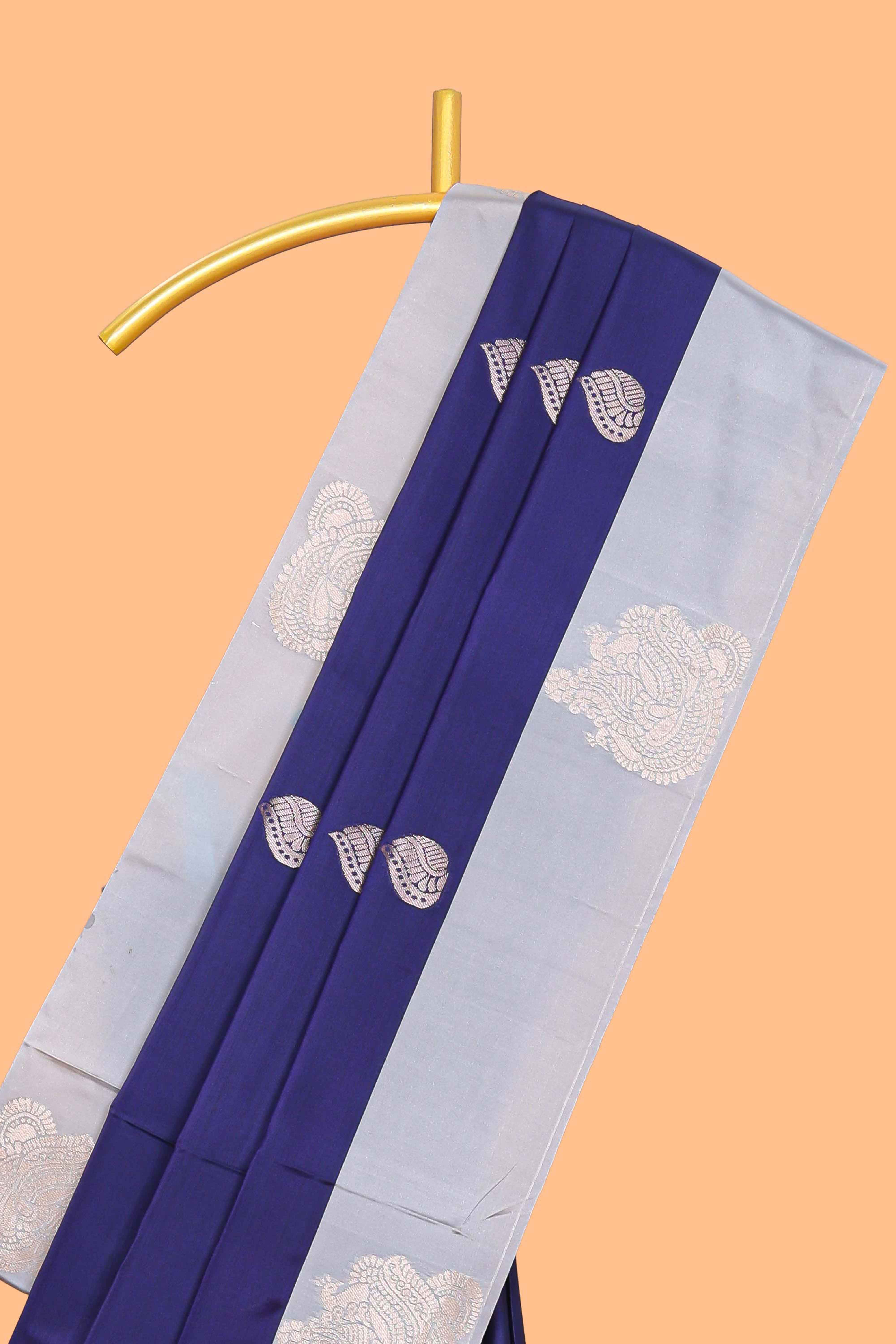 Blue zari motifs design litchi silk saree with contrast zari design border and plain blouse