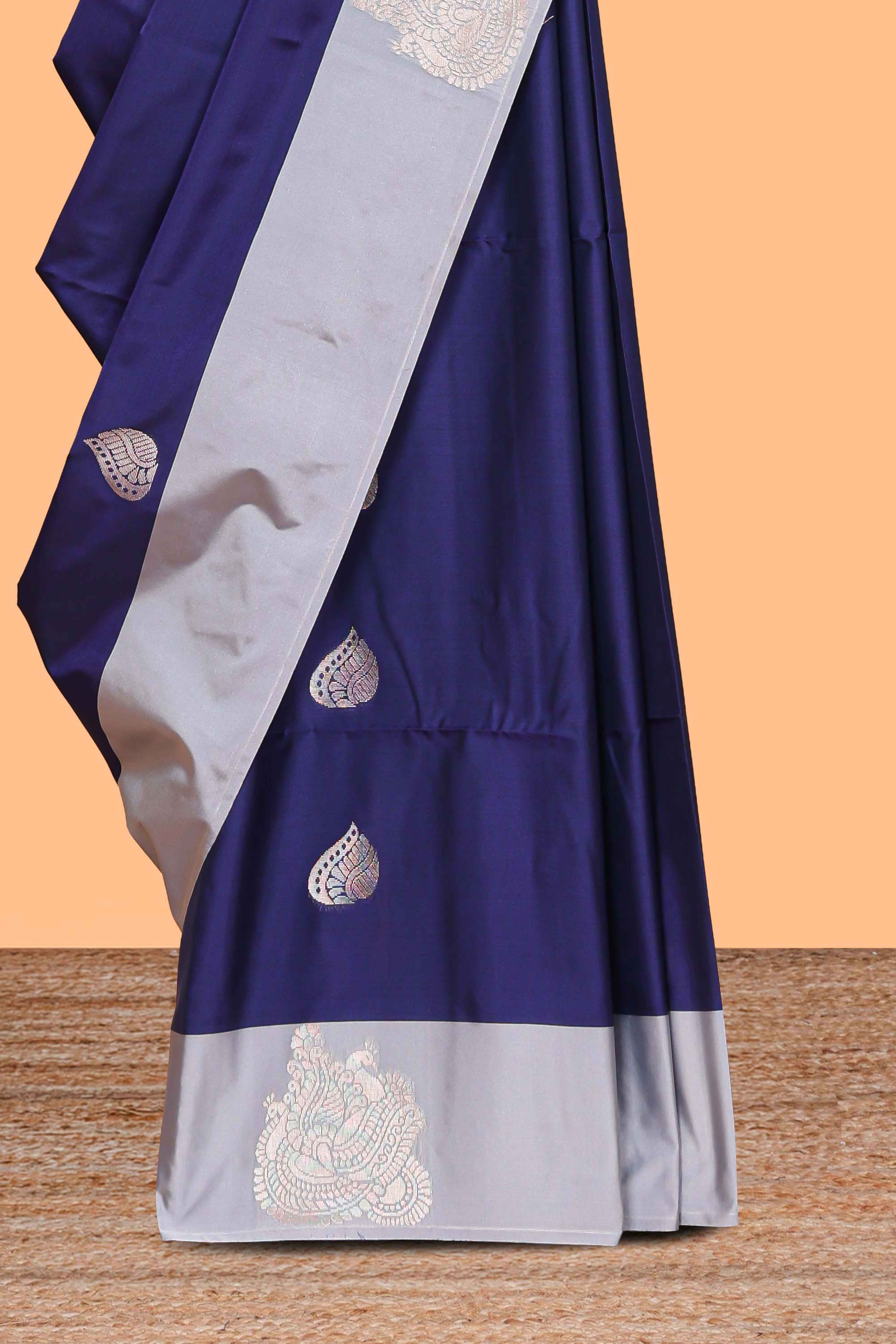 Blue zari motifs design litchi silk saree with contrast zari design border and plain blouse