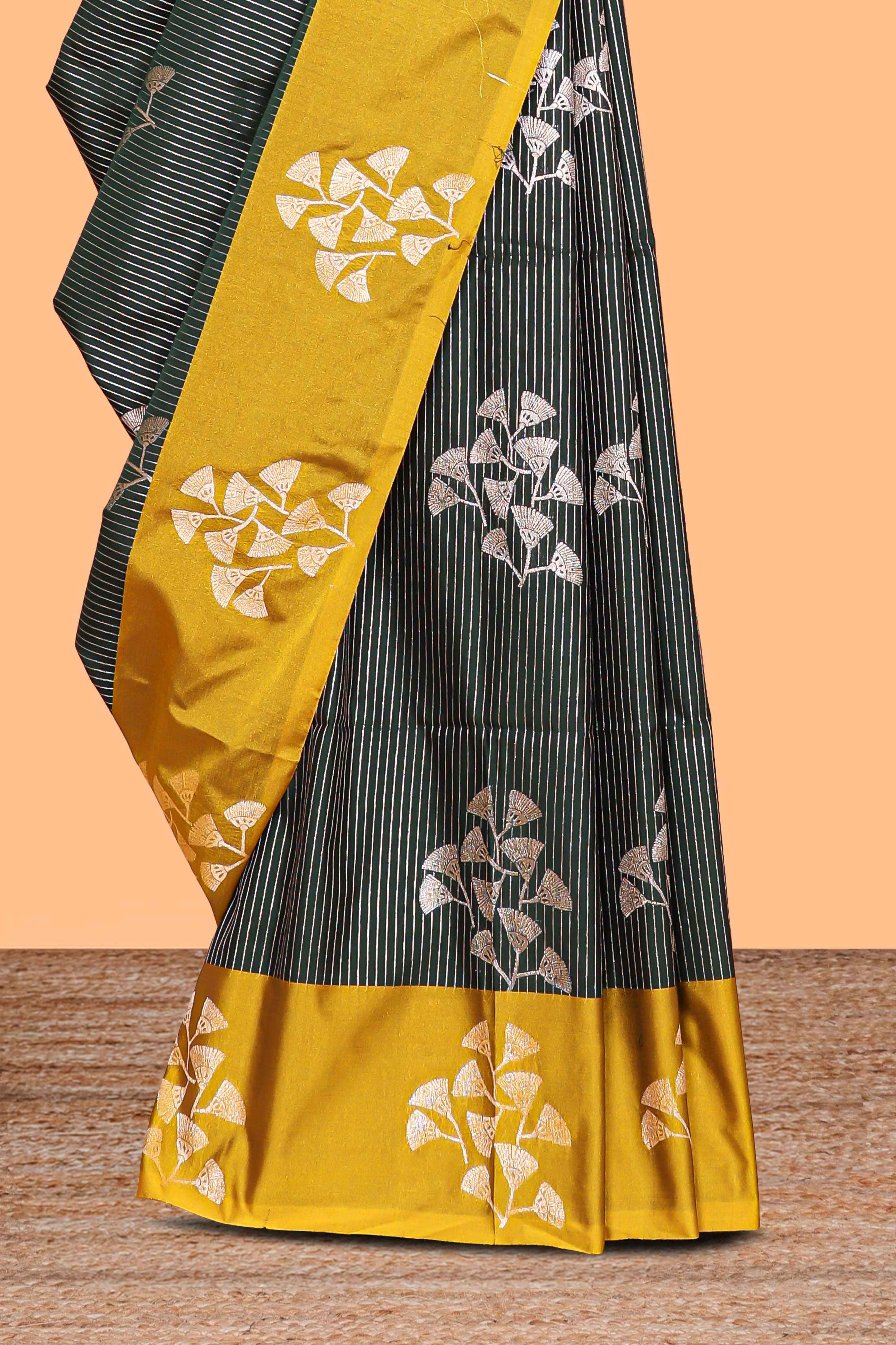 Green striped zari motifs design litchi silk saree with contrast zari design border and plain blouse