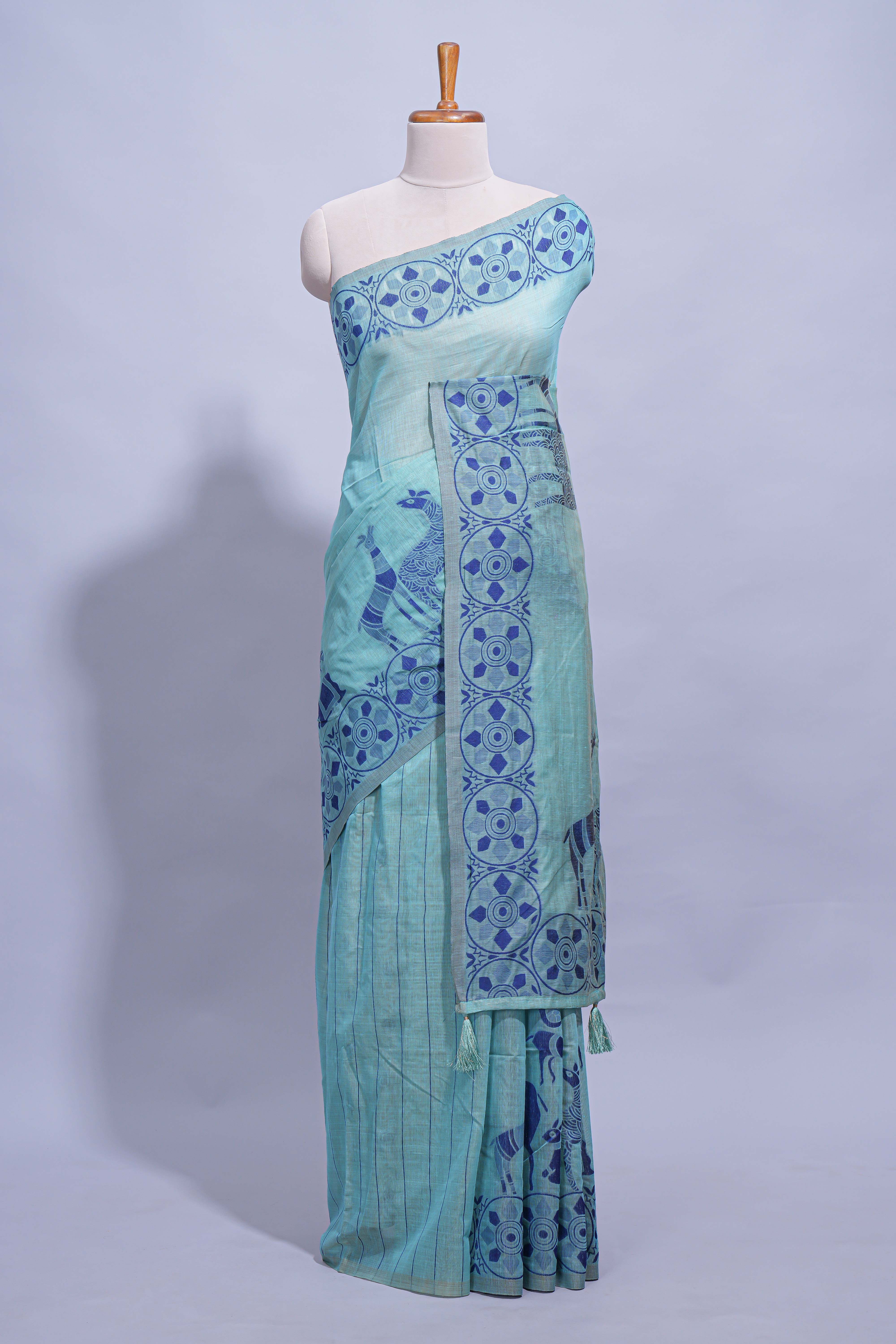 Turquoise colour munga cotton vertical thread lines thread weaving border with floral jaal thread pichwai pallu and self small butta blouse