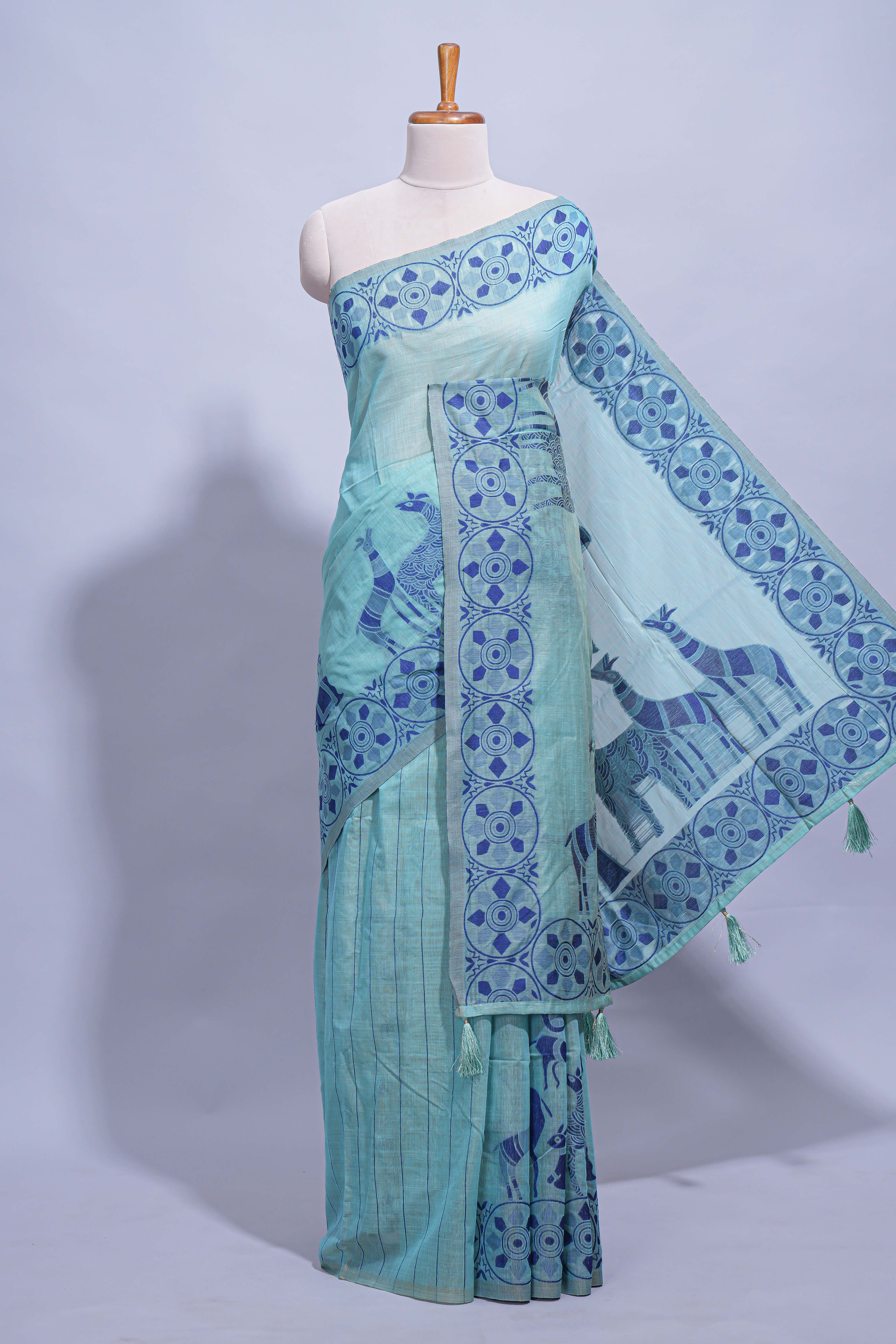 Turquoise colour munga cotton vertical thread lines thread weaving border with floral jaal thread pichwai pallu and self small butta blouse