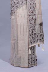 Beige colour munga cotton vertical thread lines thread weaving border with floral jaal thread pichwai pallu and self small butta blouse