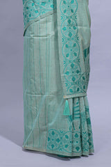 Cyan blue colour munga cotton vertical thread lines thread weaving border with floral jaal thread pichwai pallu and self small butta blouse