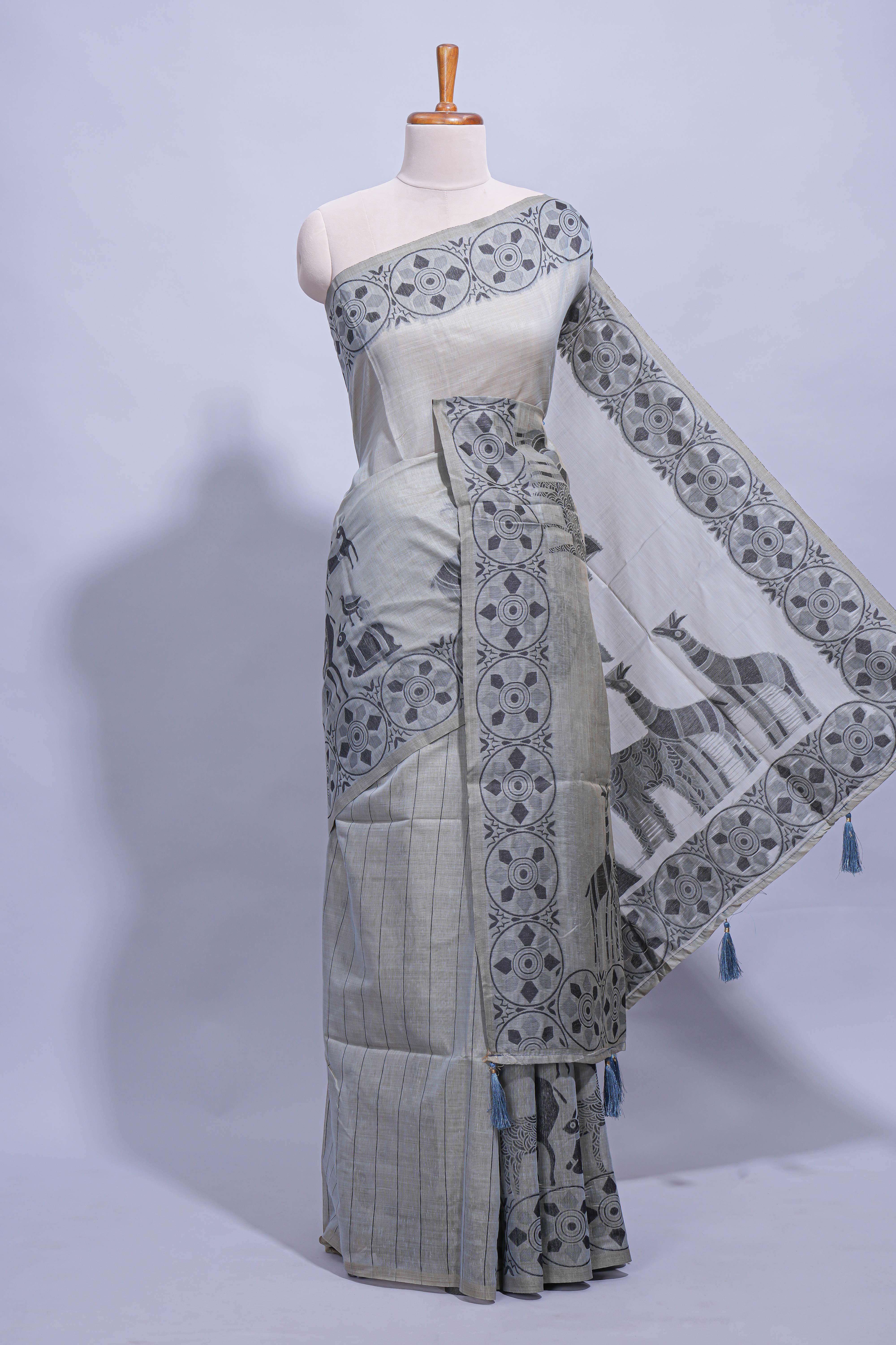 Grey colour munga cotton vertical thread lines thread weaving border with floral jaal thread pichwai pallu and self small butta blouse