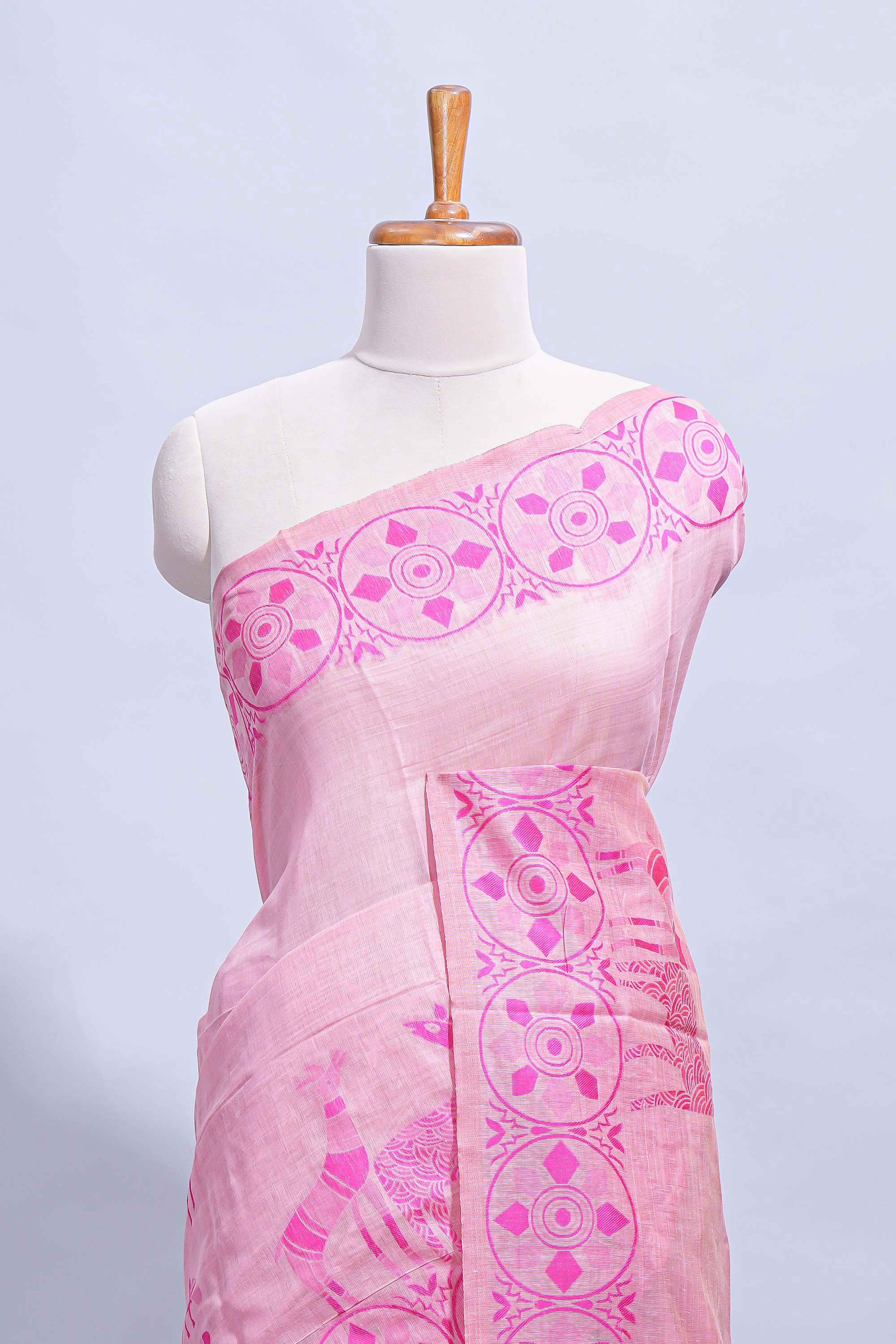Pink colour munga cotton vertical thread lines thread weaving border with floral jaal thread pichwai pallu and self small butta blouse