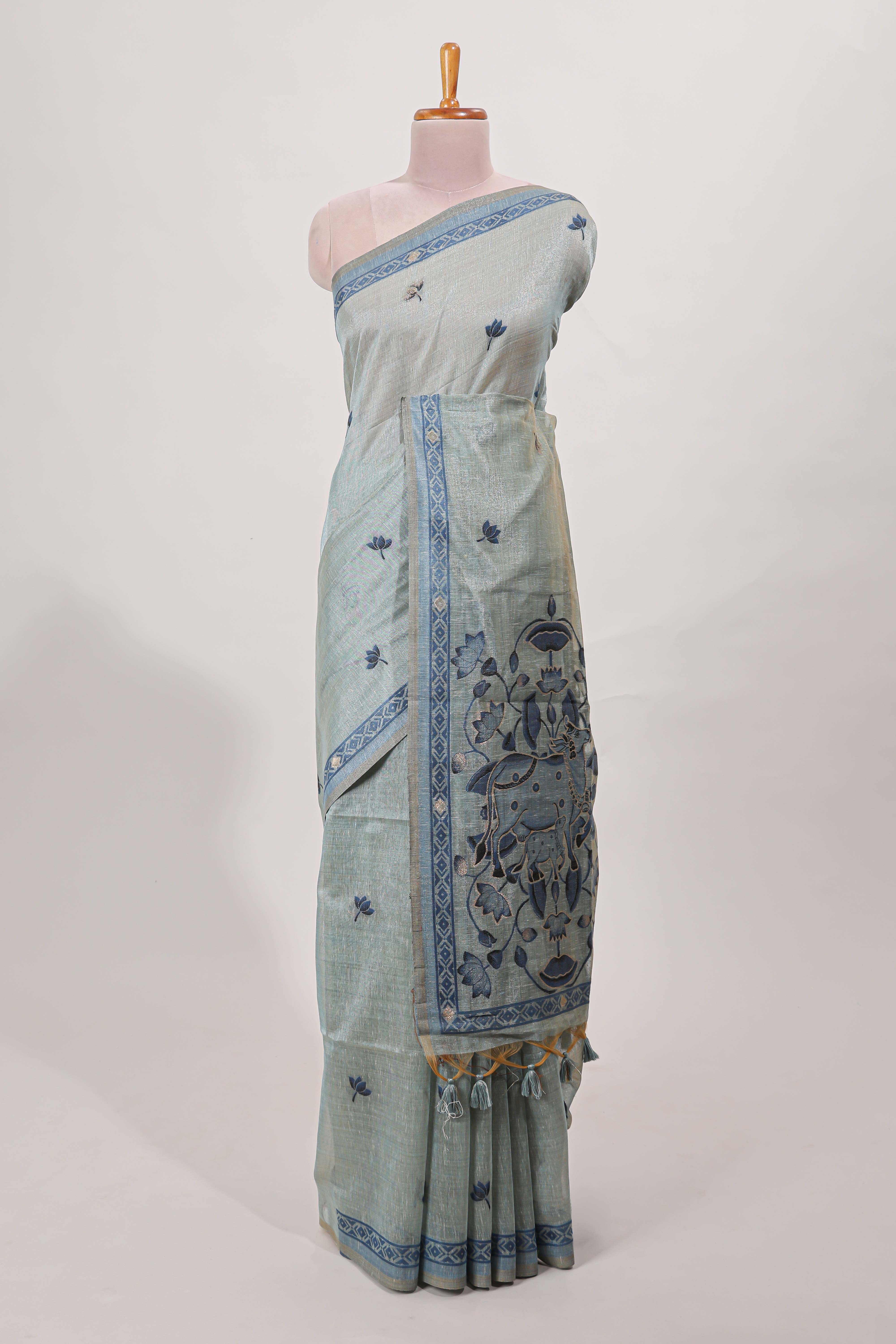 Blue munga cotton floral thread motifs thread weaving border with floral jaal thread zari pallu and contrast small butta blouse