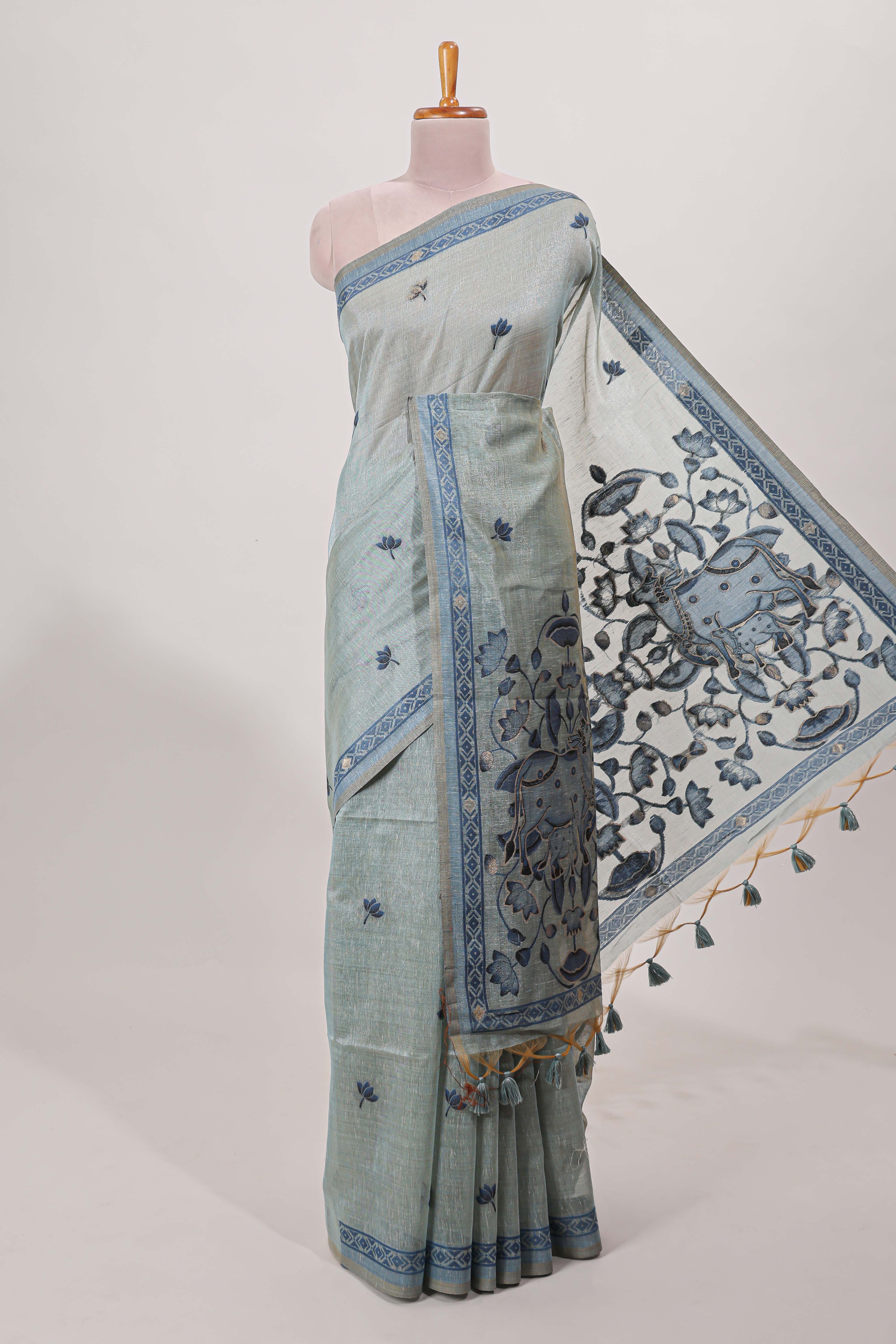 Blue munga cotton floral thread motifs thread weaving border with floral jaal thread zari pallu and contrast small butta blouse
