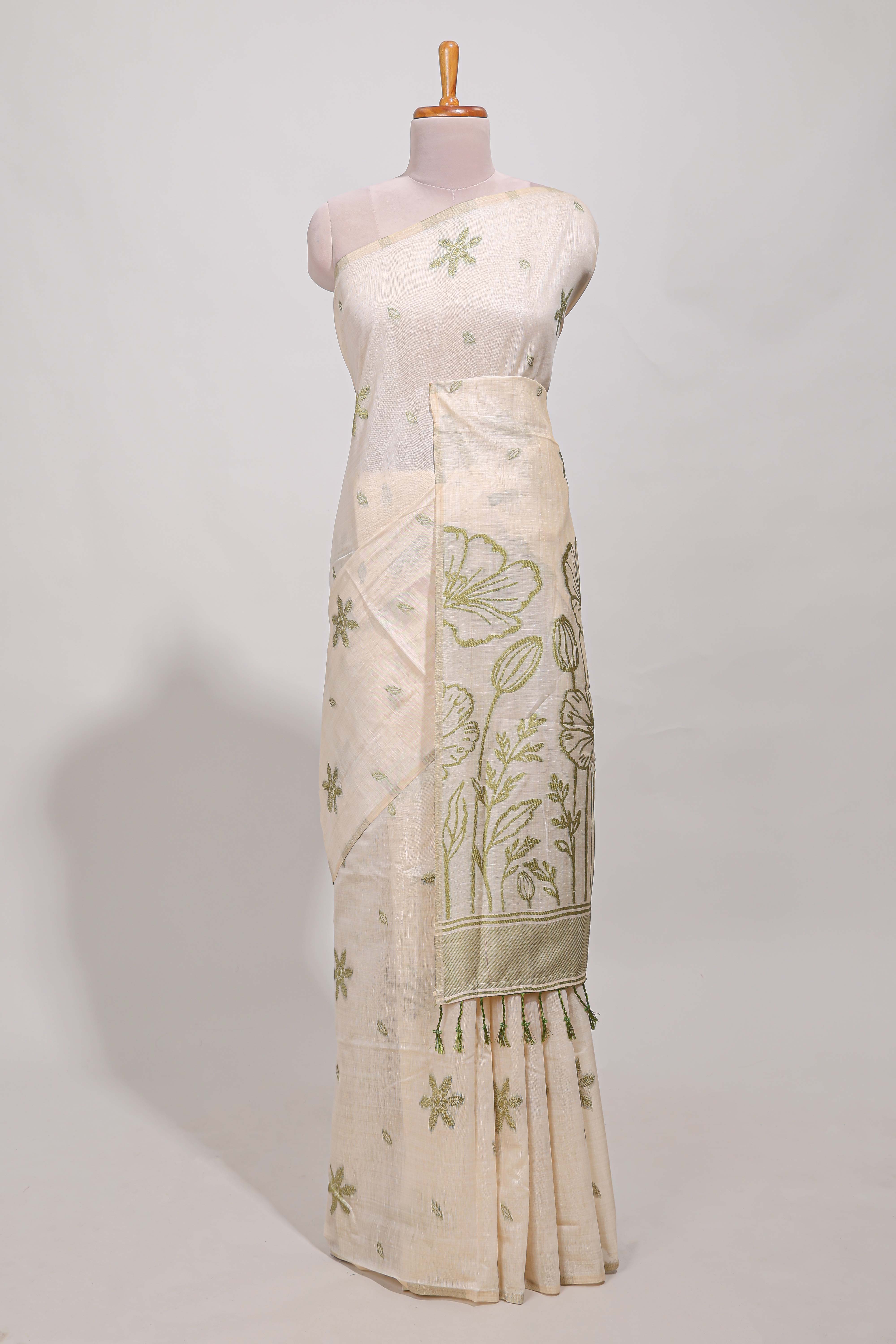 Pastel green floral printmunga cotton sareewith matching floral print pallu along with tassles