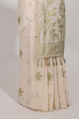 Pastel green floral printmunga cotton sareewith matching floral print pallu along with tassles