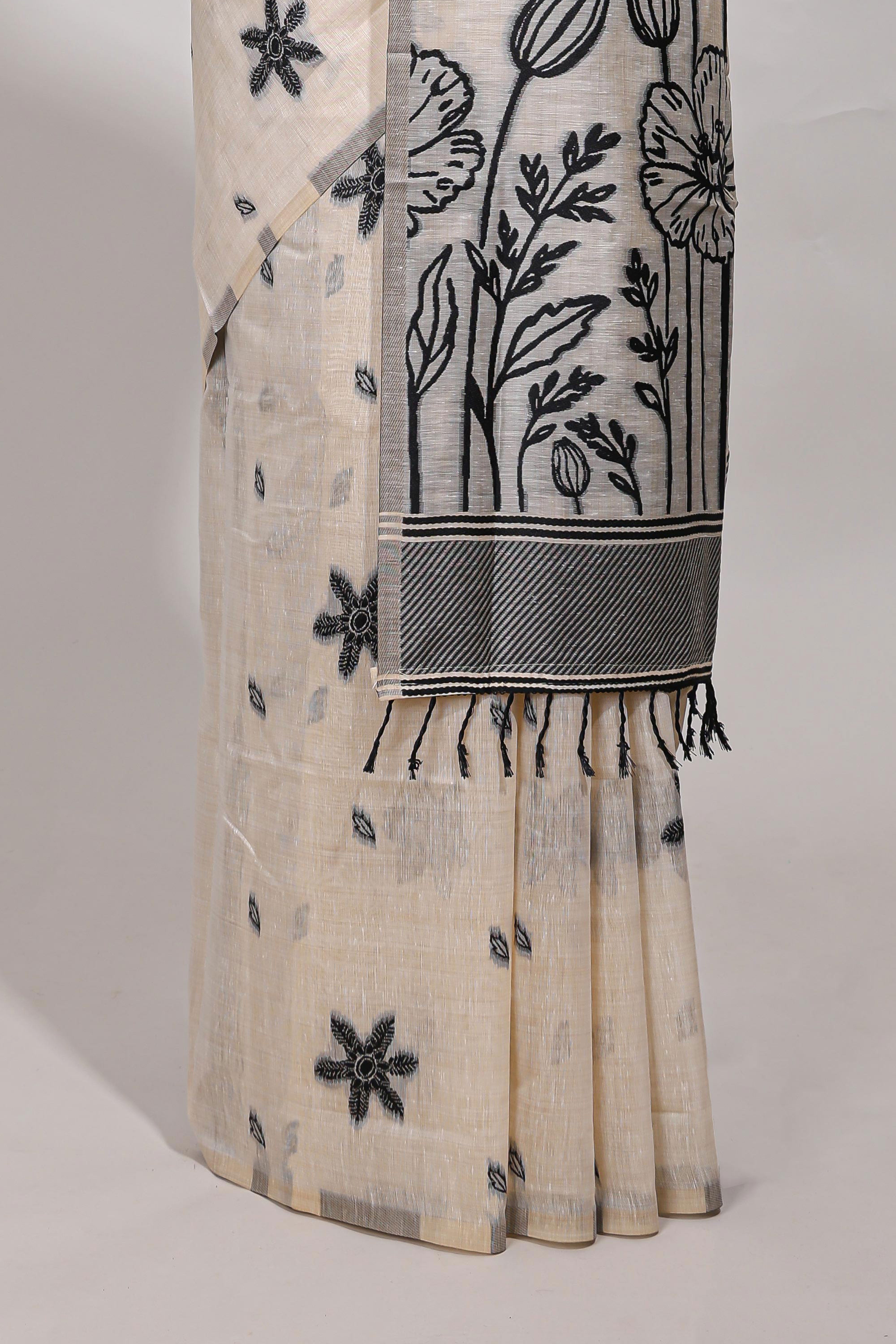 Black floral printmunga cotton sareewith matching floral print pallu along with tassles