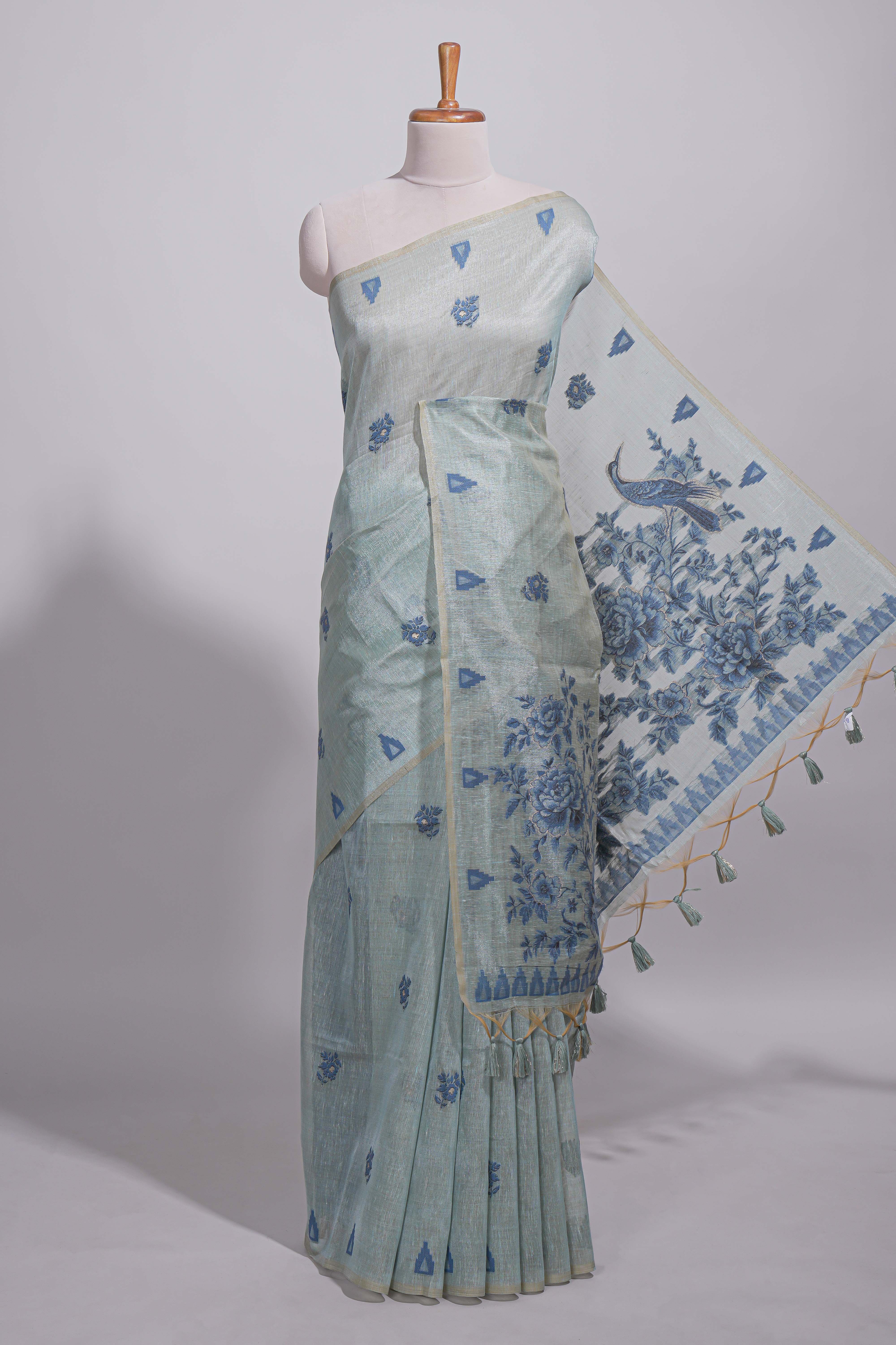 Blue munga cotton all over floral thread motifs thread weaving border with floral jaal thread zari pallu and contrast small butta blouse