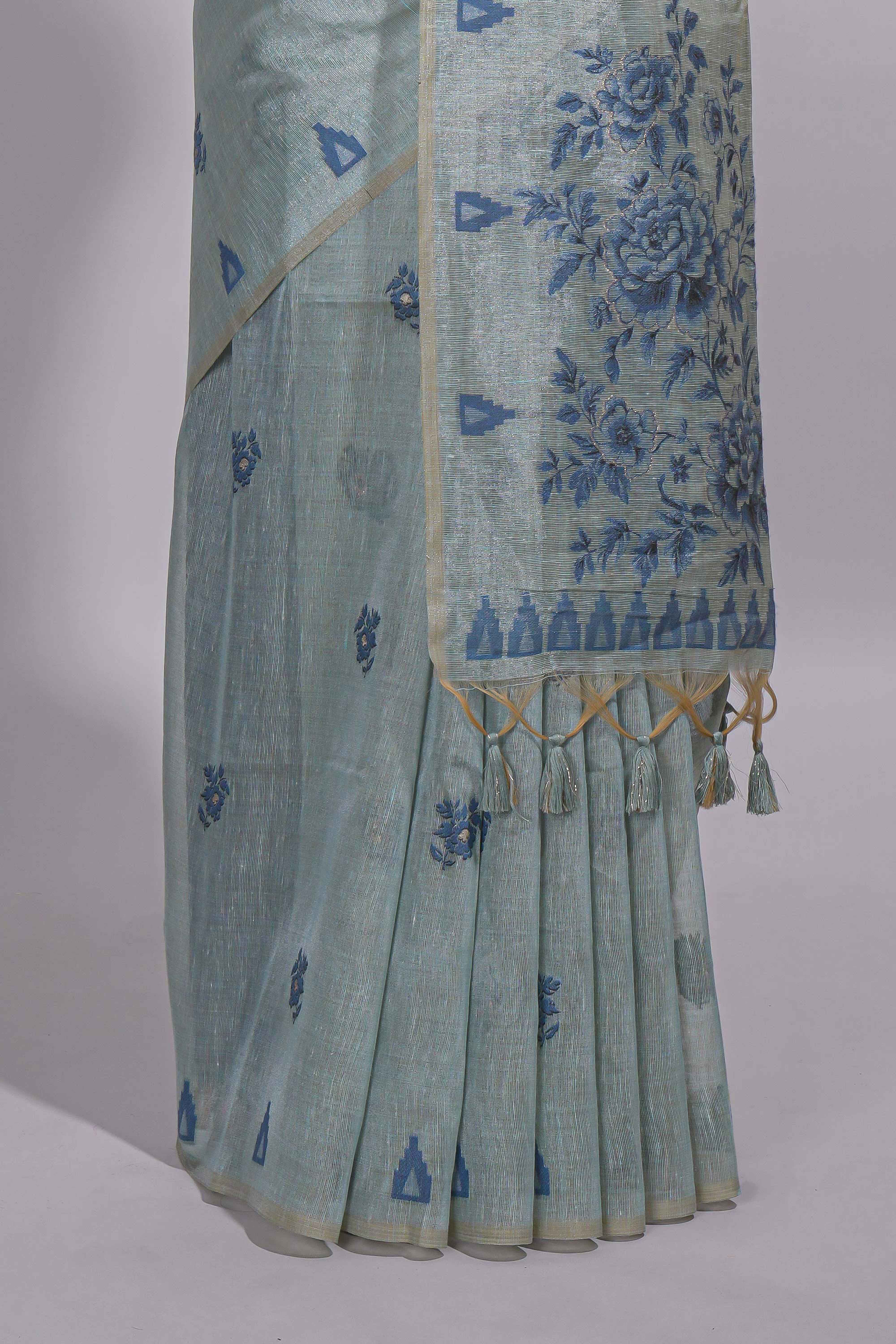 Blue munga cotton all over floral thread motifs thread weaving border with floral jaal thread zari pallu and contrast small butta blouse