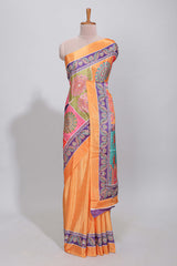 Orange floral design mirror work masakali saree with self border and contrast motifs blouse