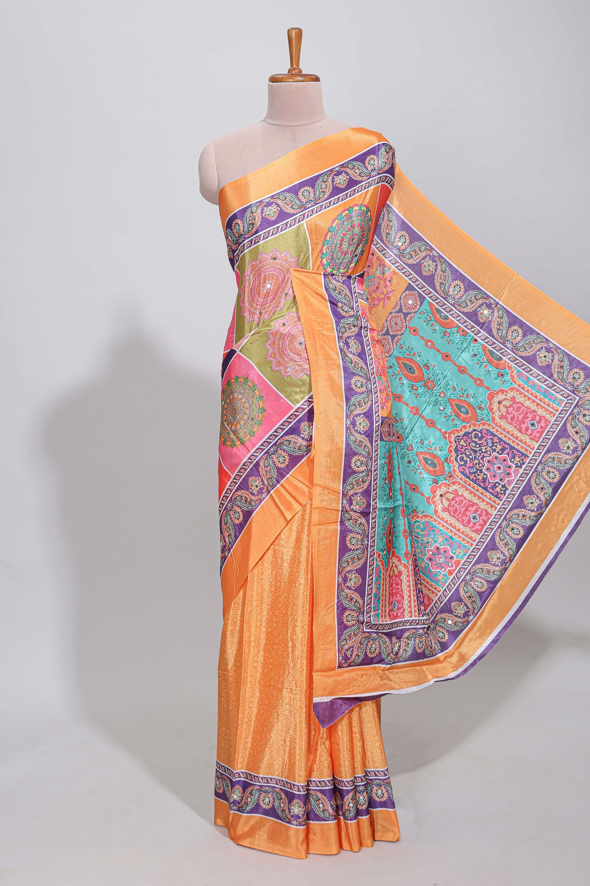 Orange floral design mirror work masakali saree with self border and contrast motifs blouse