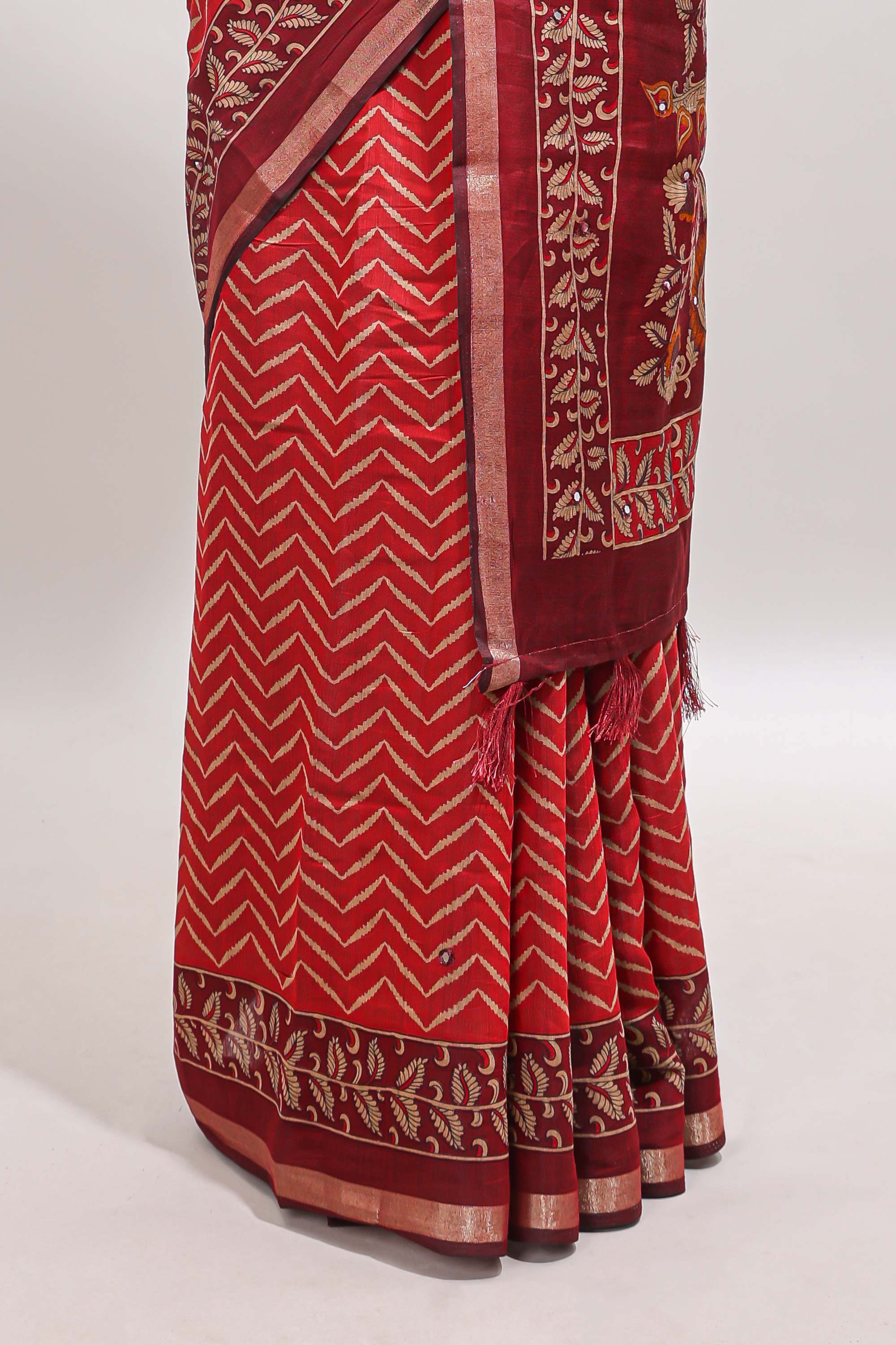 Red chevron print marsh mellow saree with contrast zari border and contrast blouse