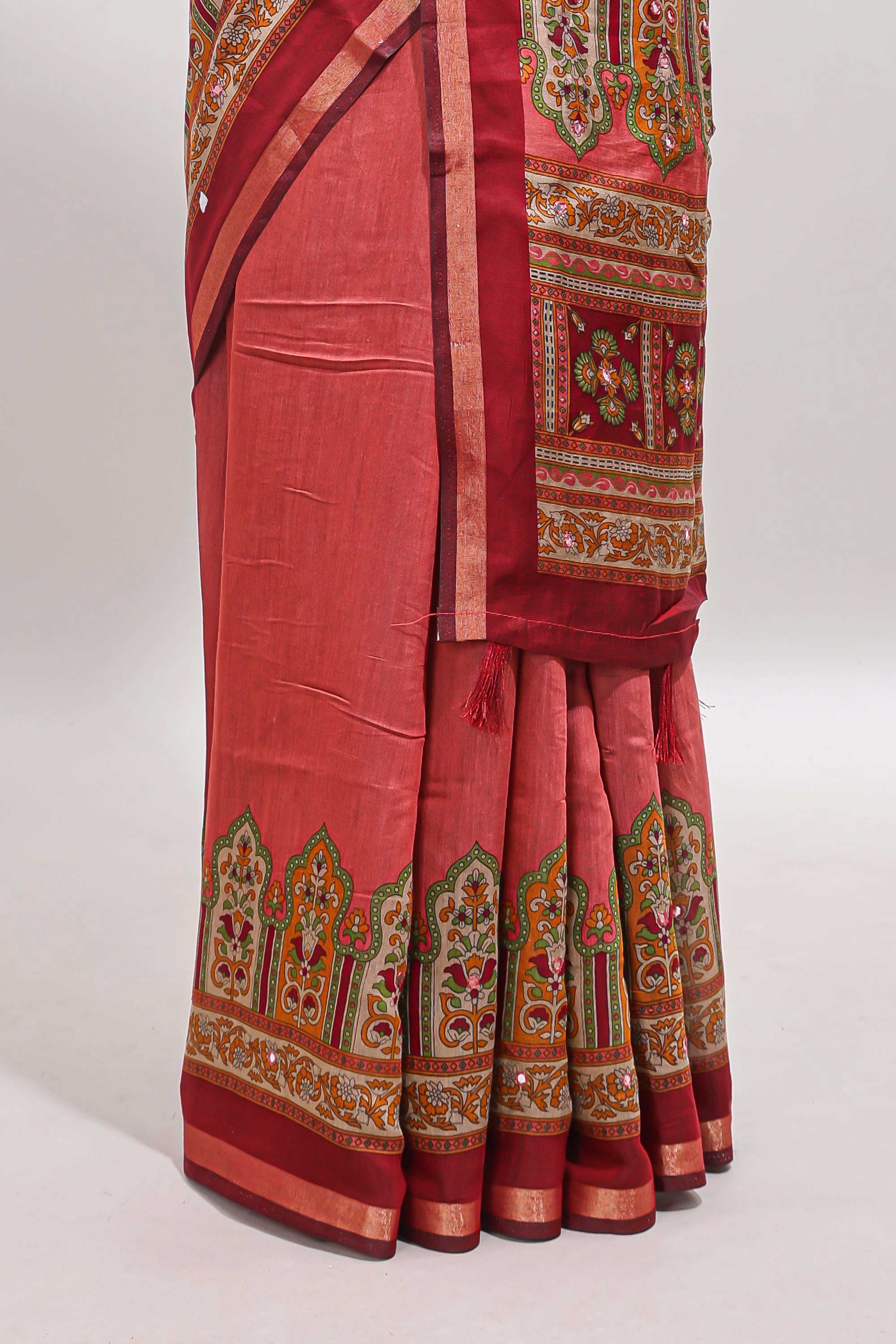 Peach printed marsh mellow saree with contrast floral border and tassel pallu