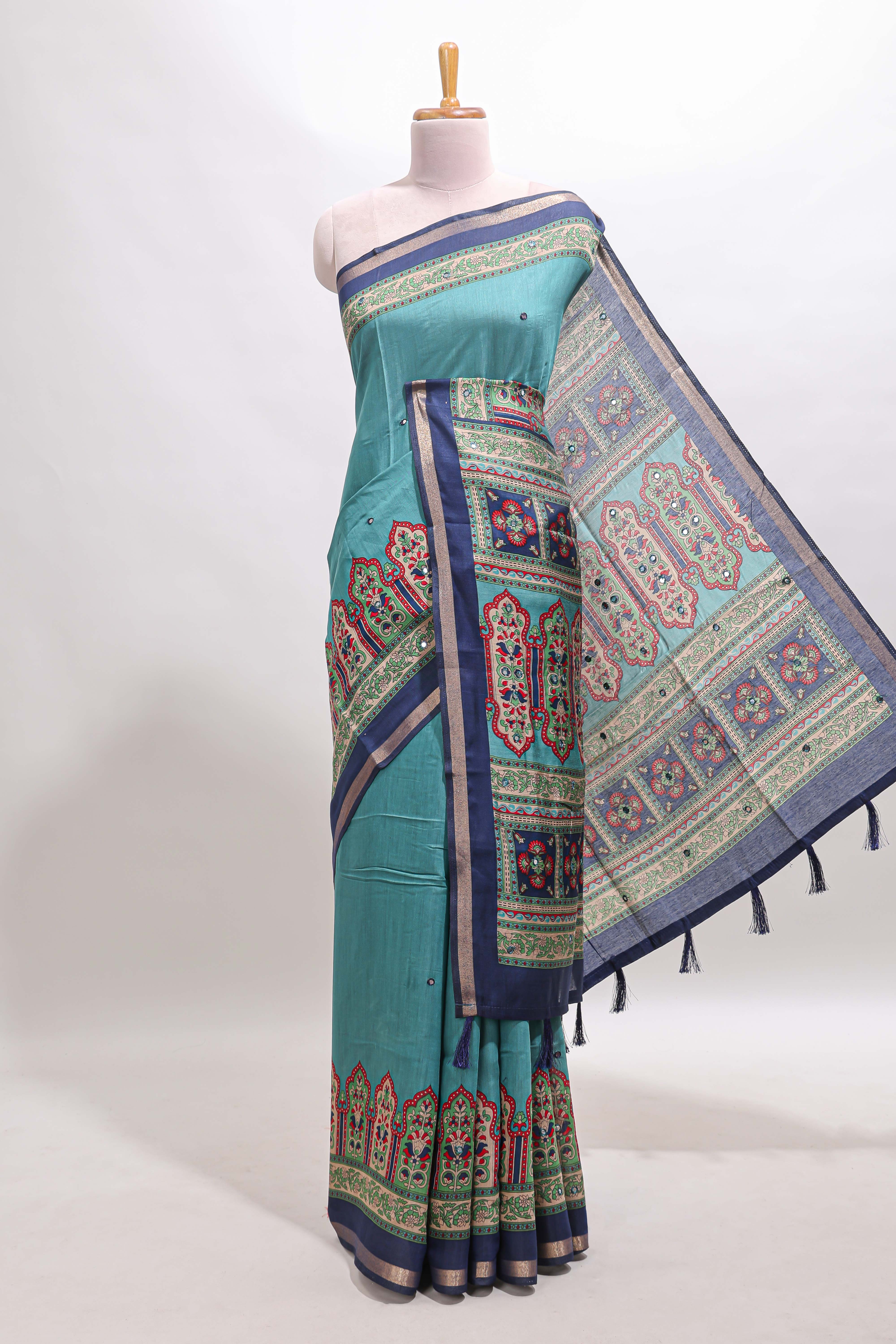 Blue printed marsh mellow saree with contrast floral border and tassel pallu