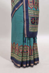 Blue printed marsh mellow saree with contrast floral border and tassel pallu