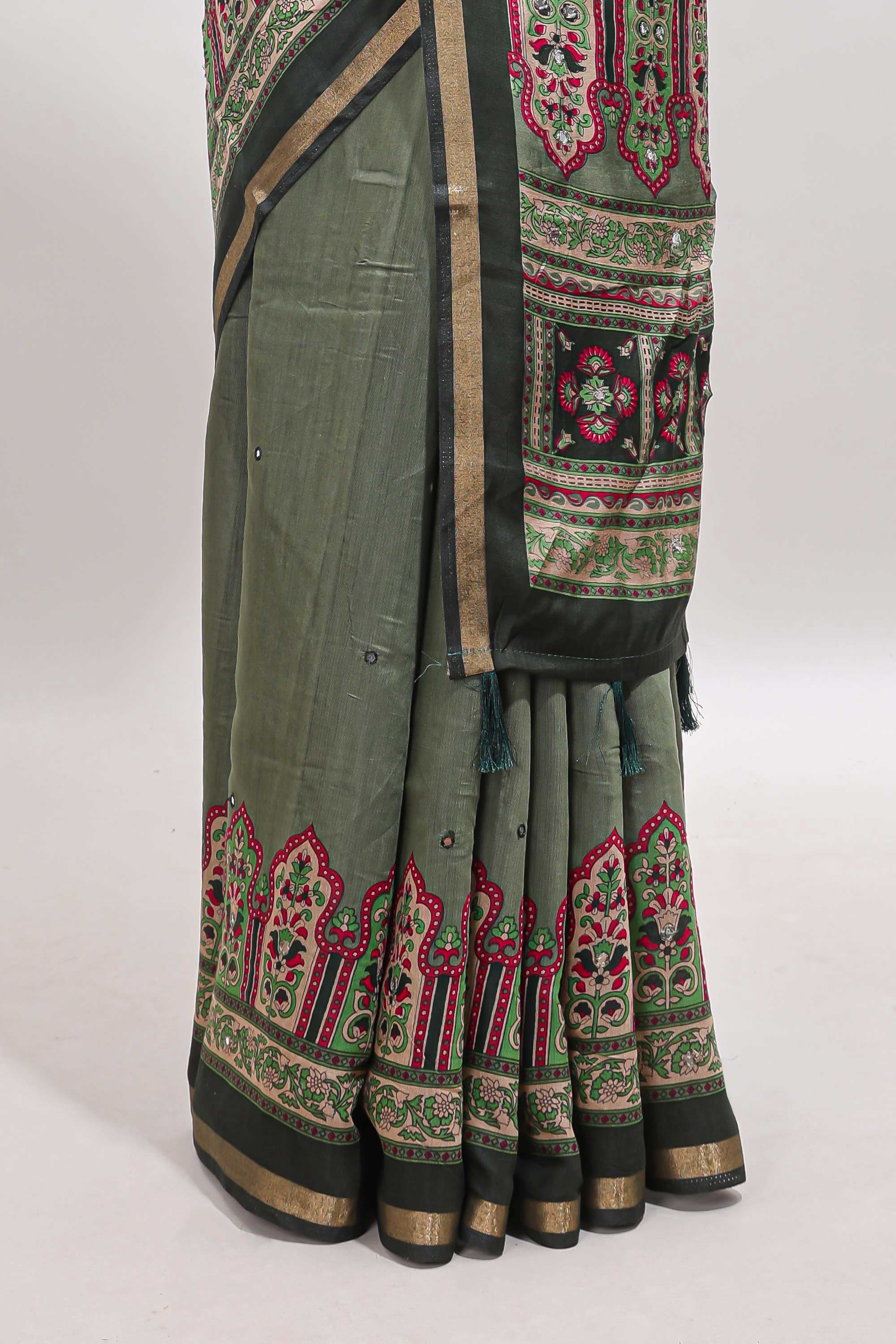 Green printed marsh mellow saree with contrast floral border and tassel pallu