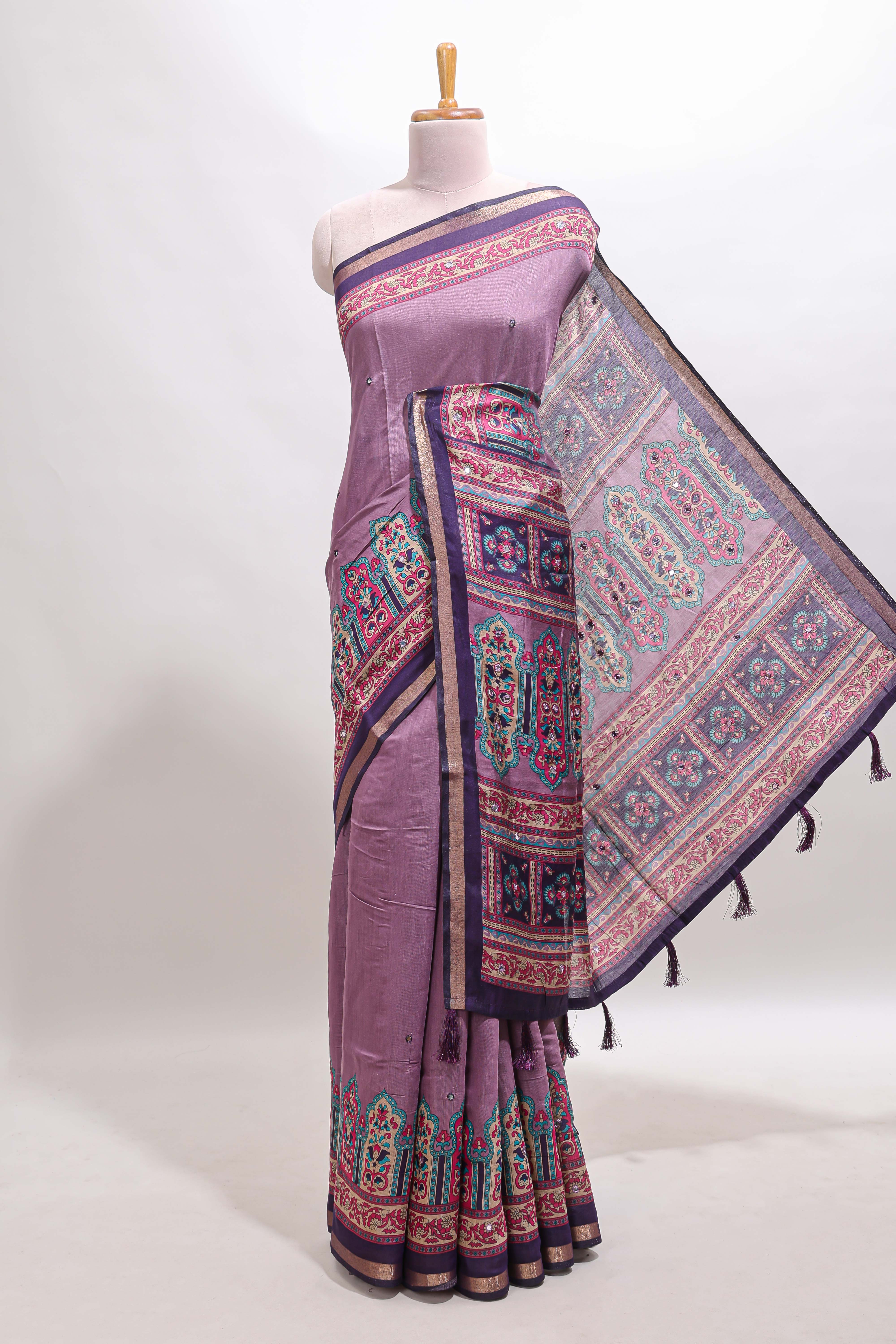 Purple printed marsh mellow saree with contrast floral border and tassel pallu