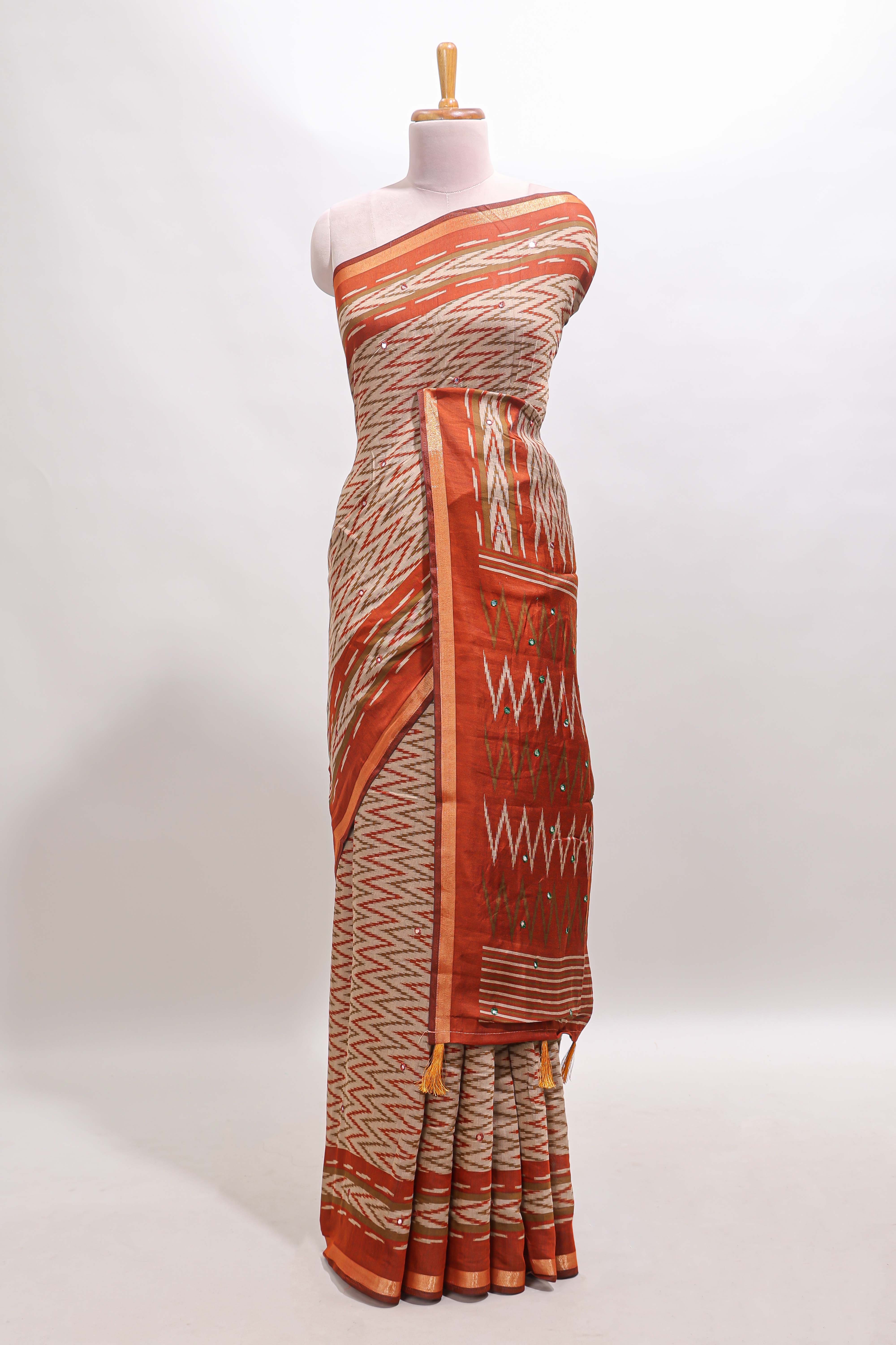 Beige chevron embroidery mirror work marsh mellow saree with contrast orange border and printed blouse