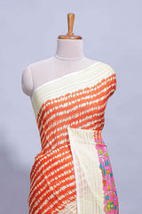 Orange colourshibori printed marsh mellow saree with contrast border and matching printed blouse