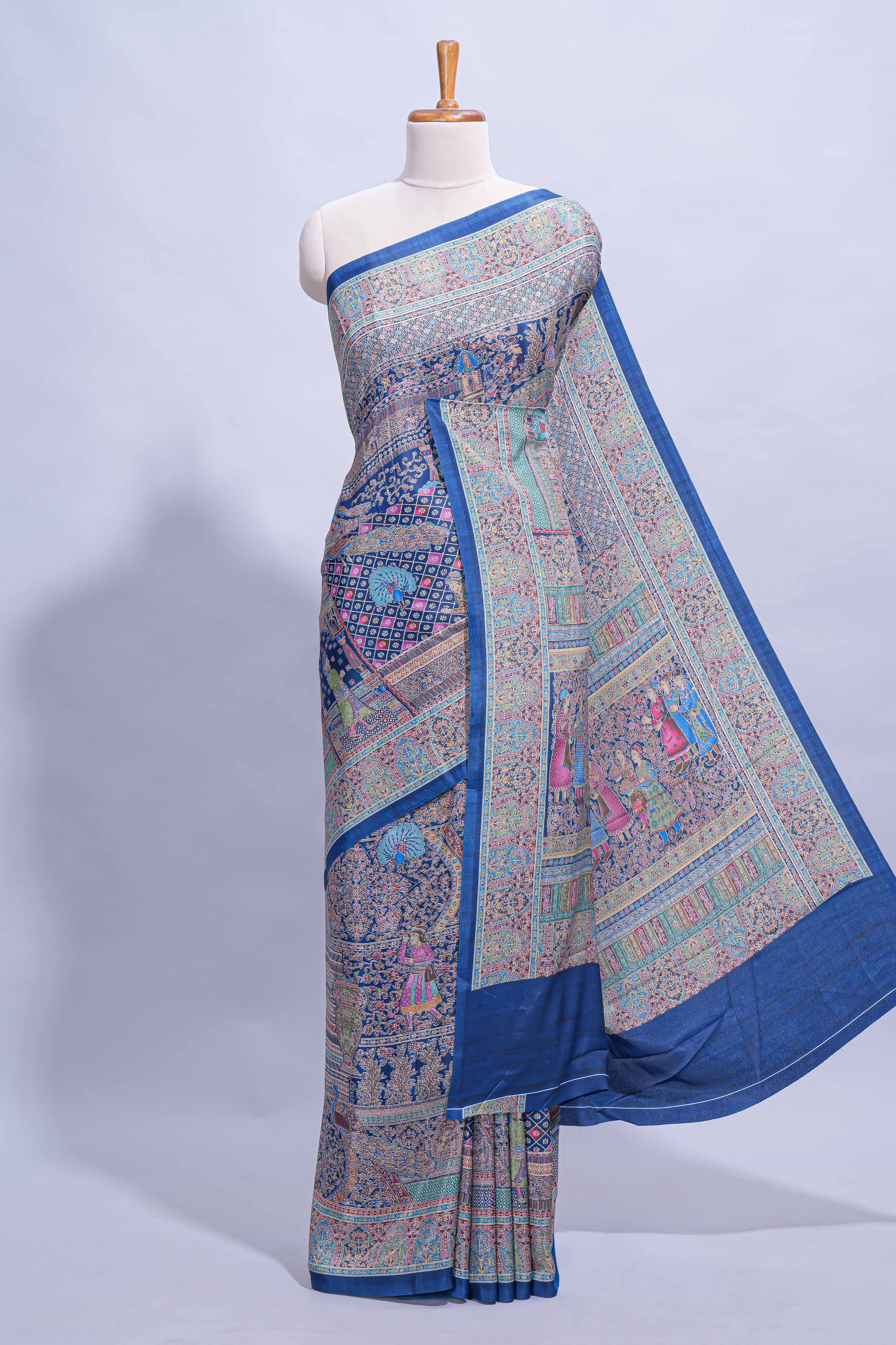 Royal blue mughal printed marsh mellow saree with self border and self printed pallu along with matching blouse