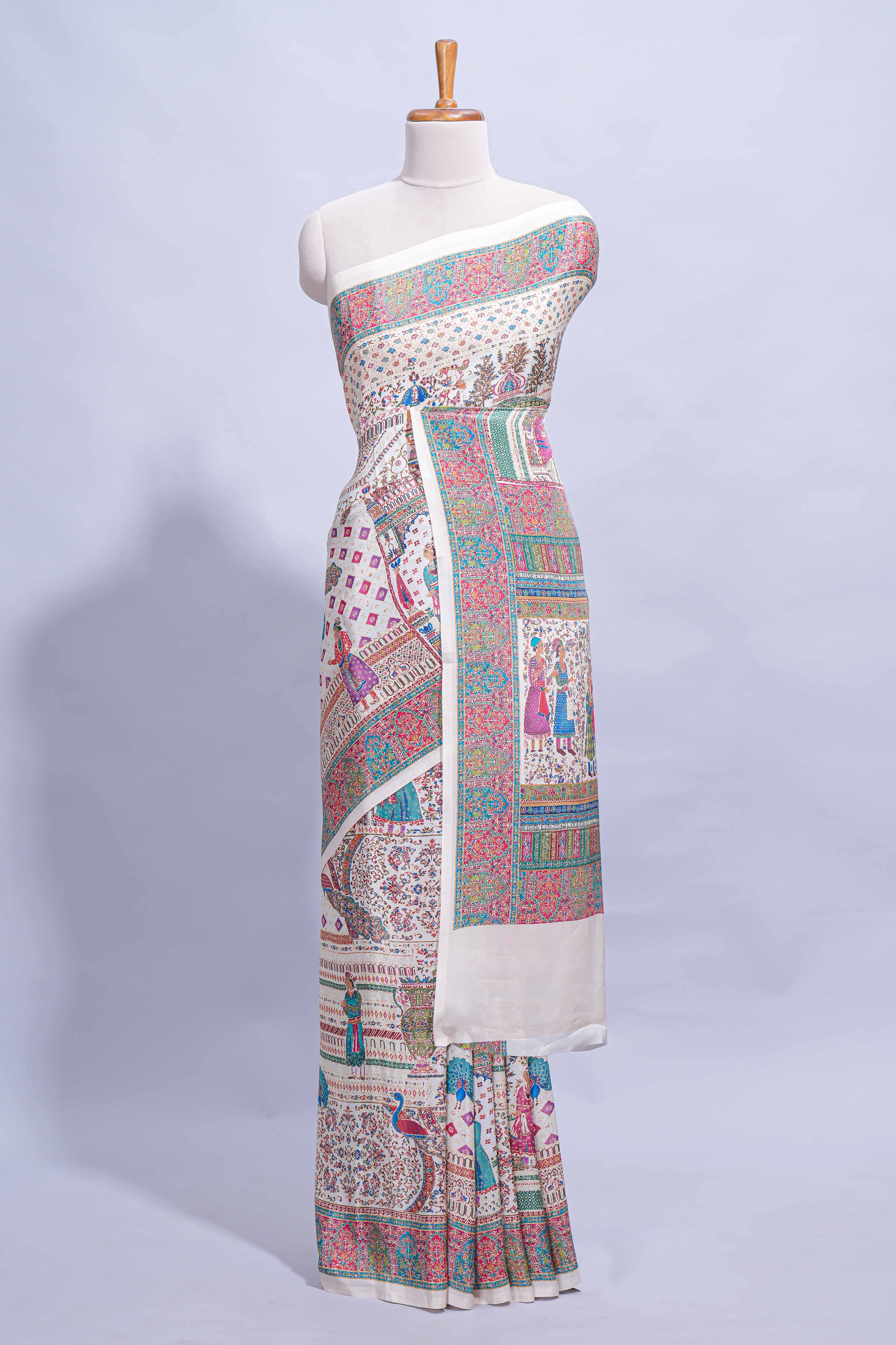 Ivory colour mughal printed marsh mellow saree with self border and self printed pallu along with matching blouse