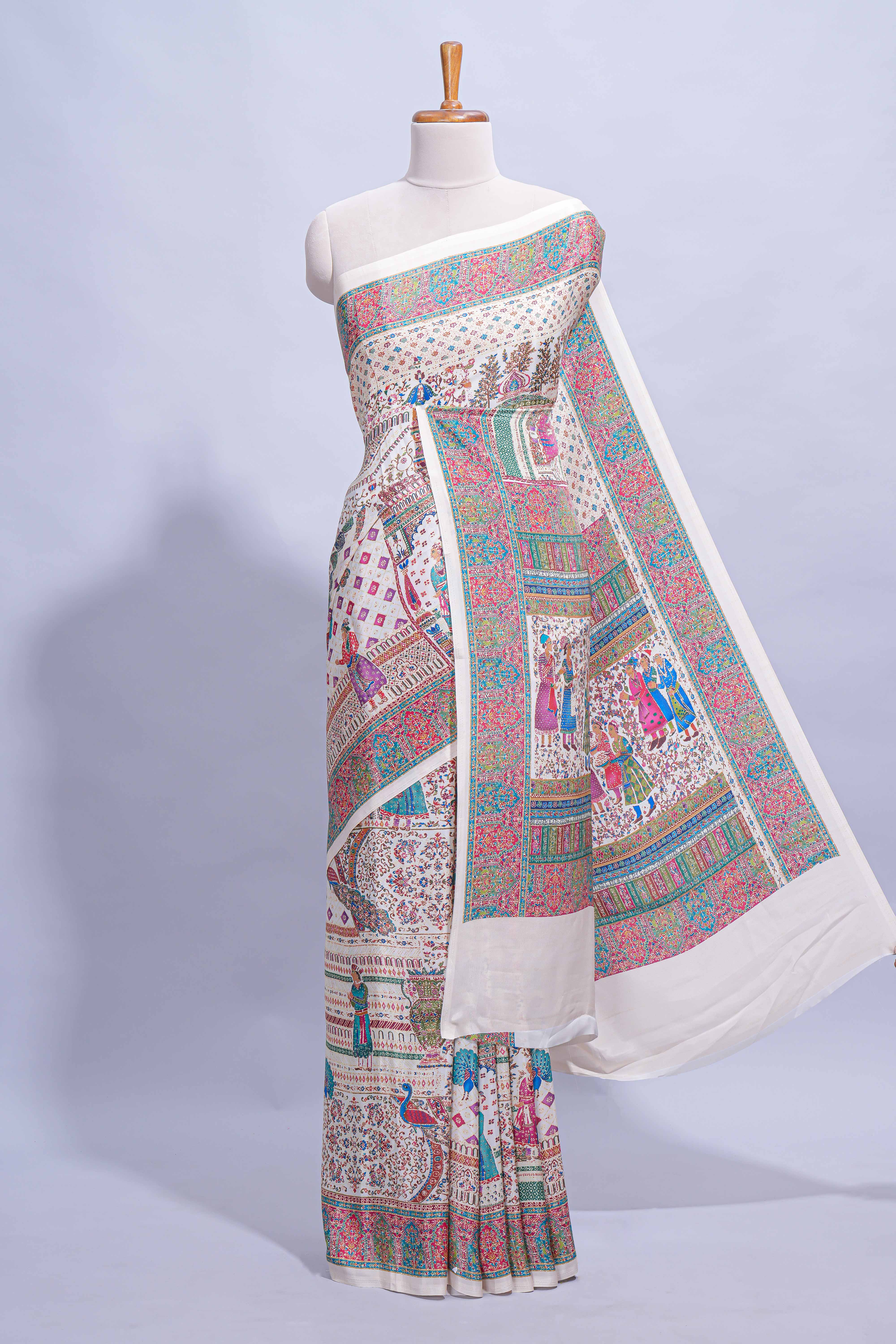 Ivory colour mughal printed marsh mellow saree with self border and self printed pallu along with matching blouse