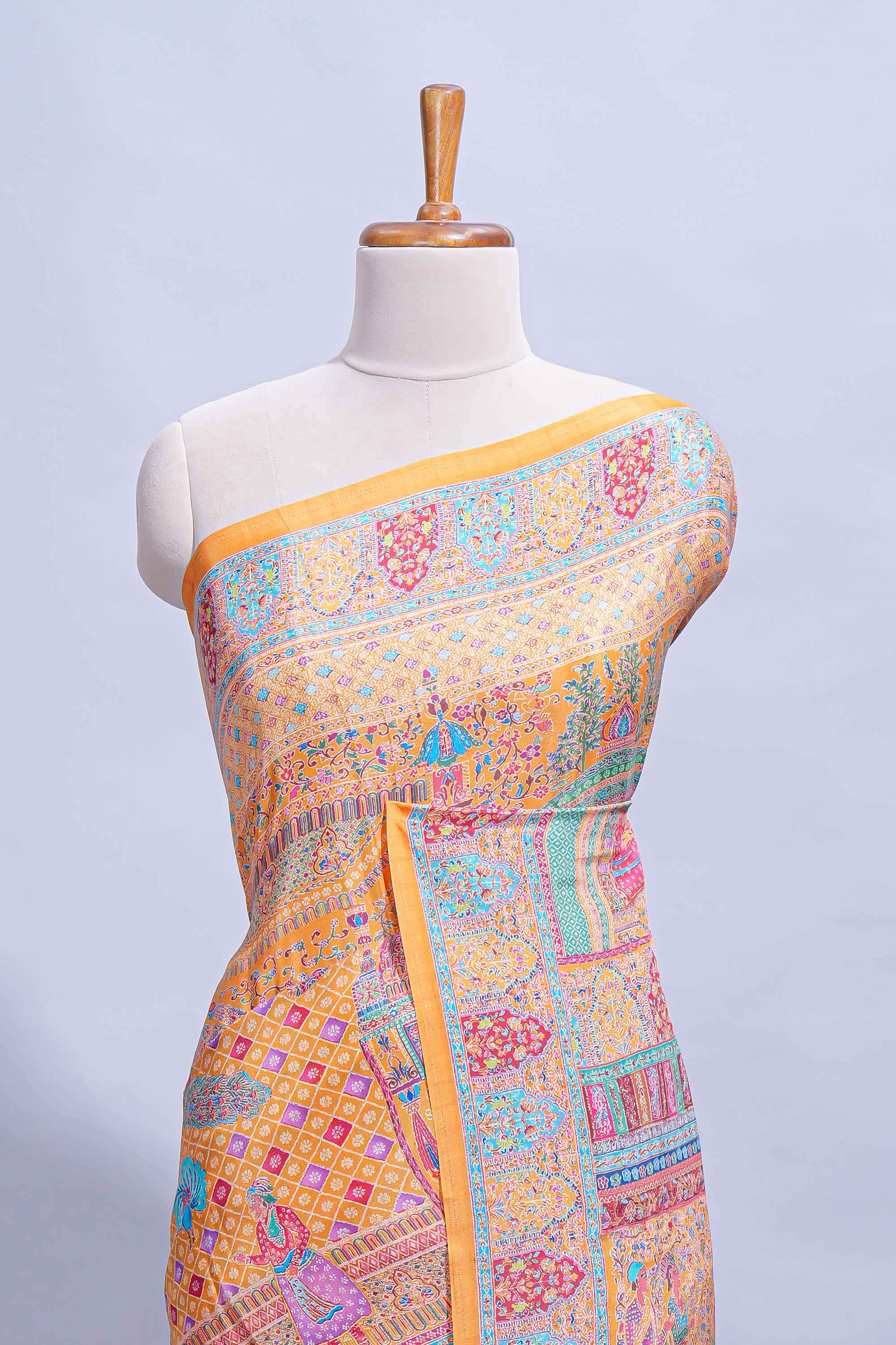 Orange colour mughal printed marsh mellow saree with self border and self printed pallu along with matching blouse
