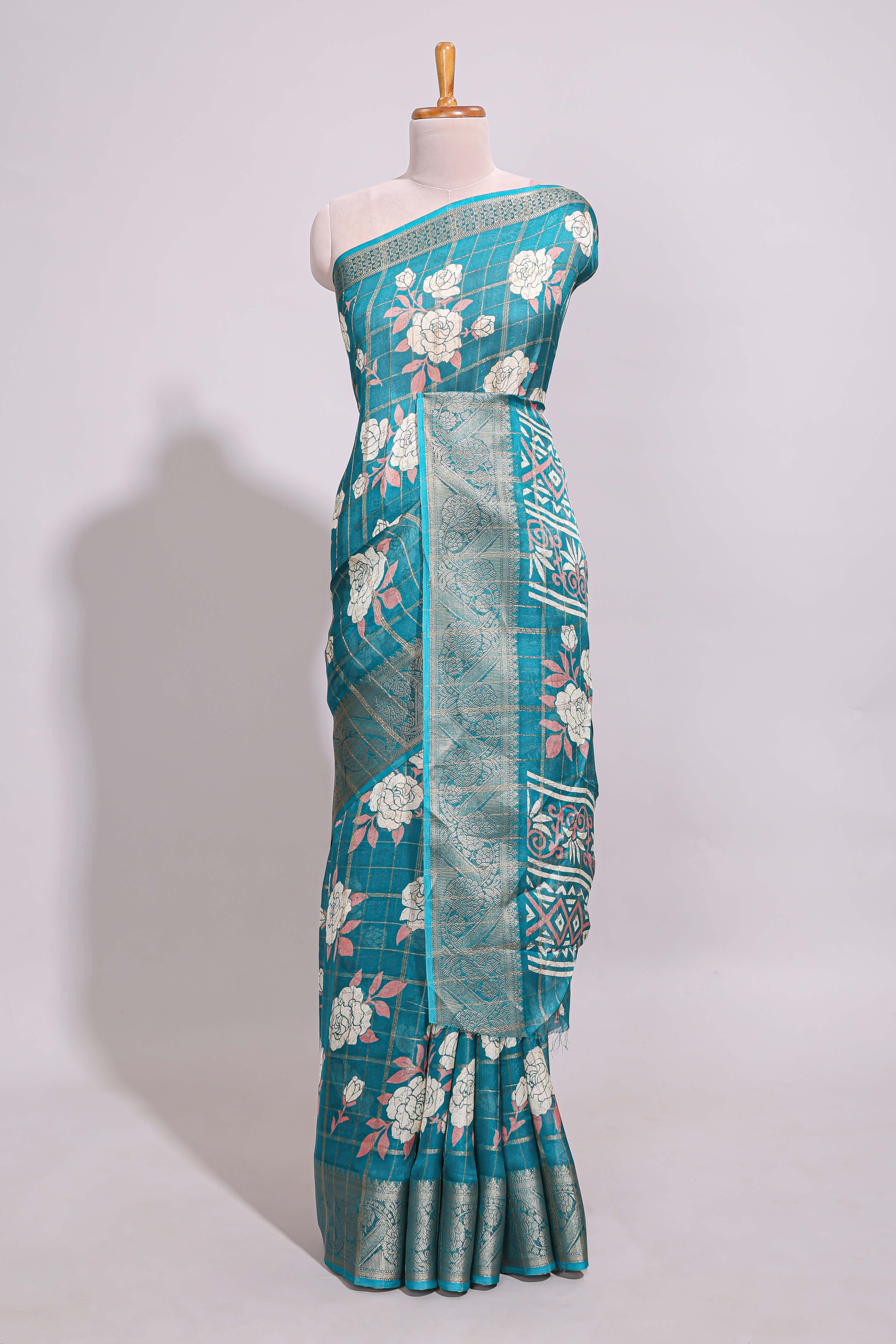 Teal green checked floral design marsh mellow saree with self zari border and matching blouse
