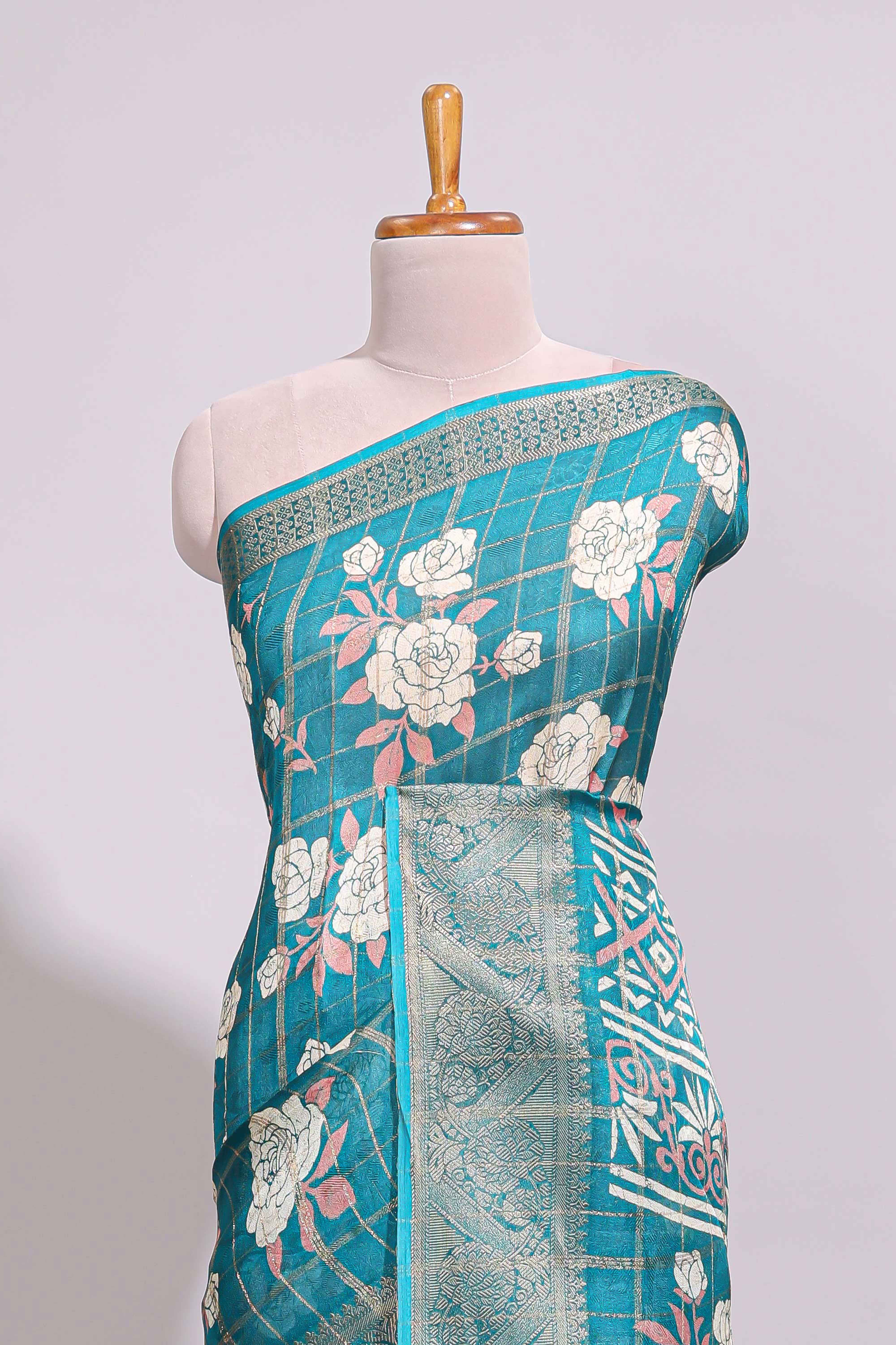 Teal green checked floral design marsh mellow saree with self zari border and matching blouse