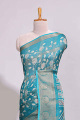 Teal green checked floral design marsh mellow saree with self zari border and matching zari blouse