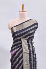 Lavender zari design mushru silk saree with contrast striped zari border and blouse