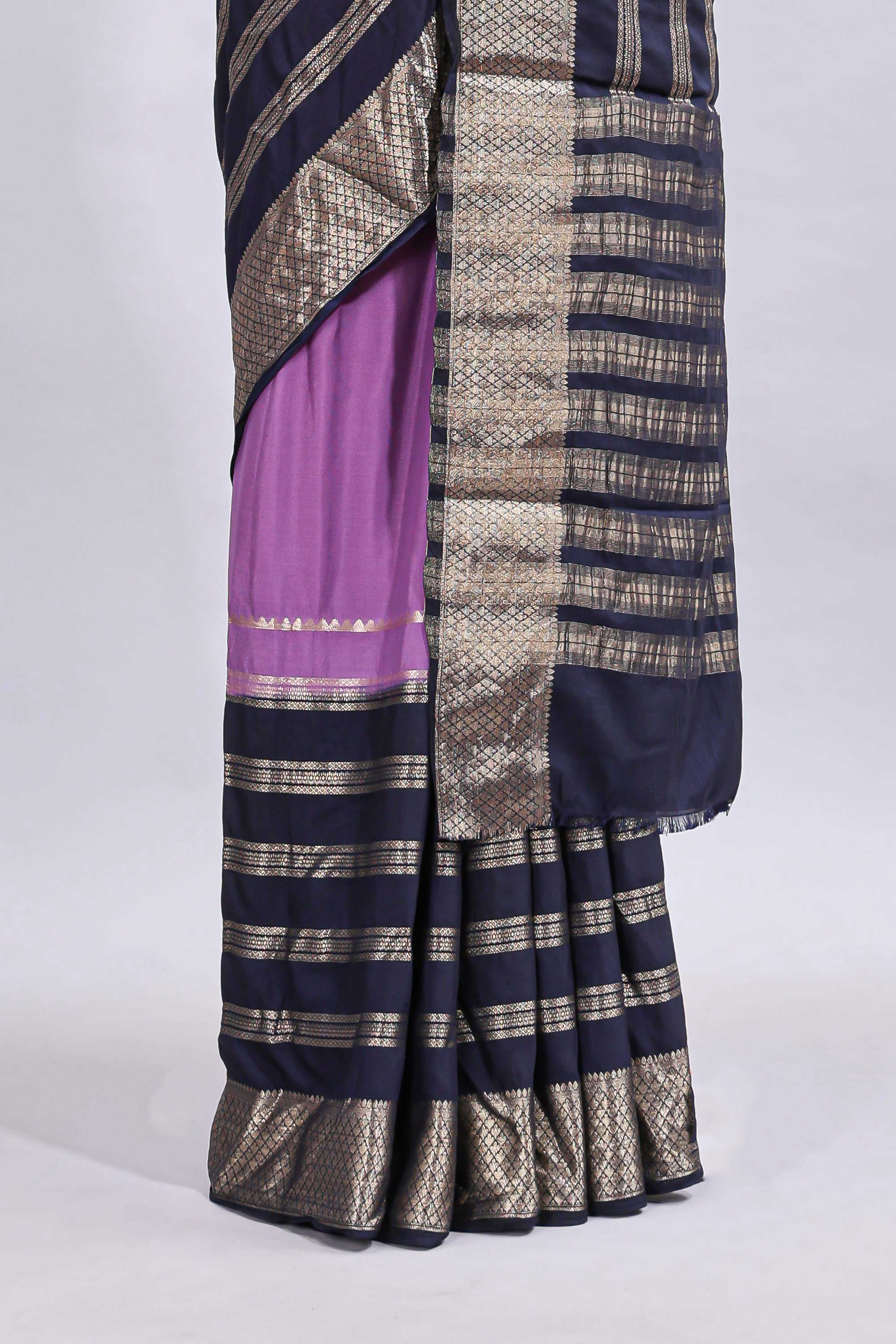 Lavender zari design mushru silk saree with contrast striped zari border and blouse