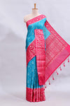 Blue floral design mushru silk saree with contrast border and zari blouse