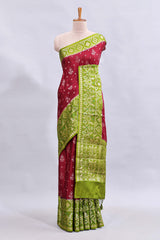 Maroon floral design mushru silk saree with contrast border and zari blouse
