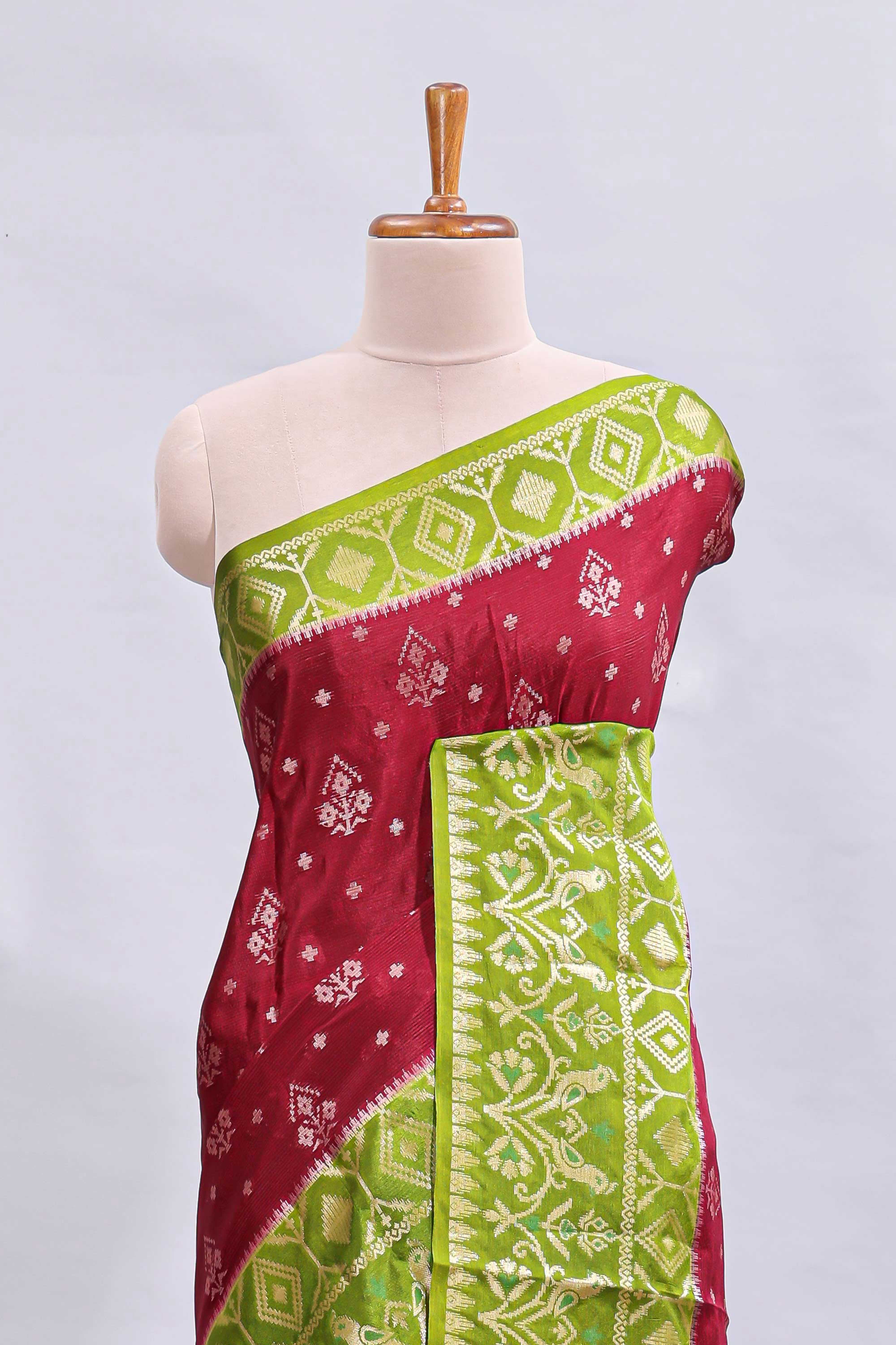 Maroon floral design mushru silk saree with contrast border and zari blouse