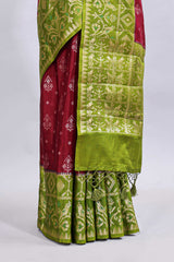 Maroon floral design mushru silk saree with contrast border and zari blouse